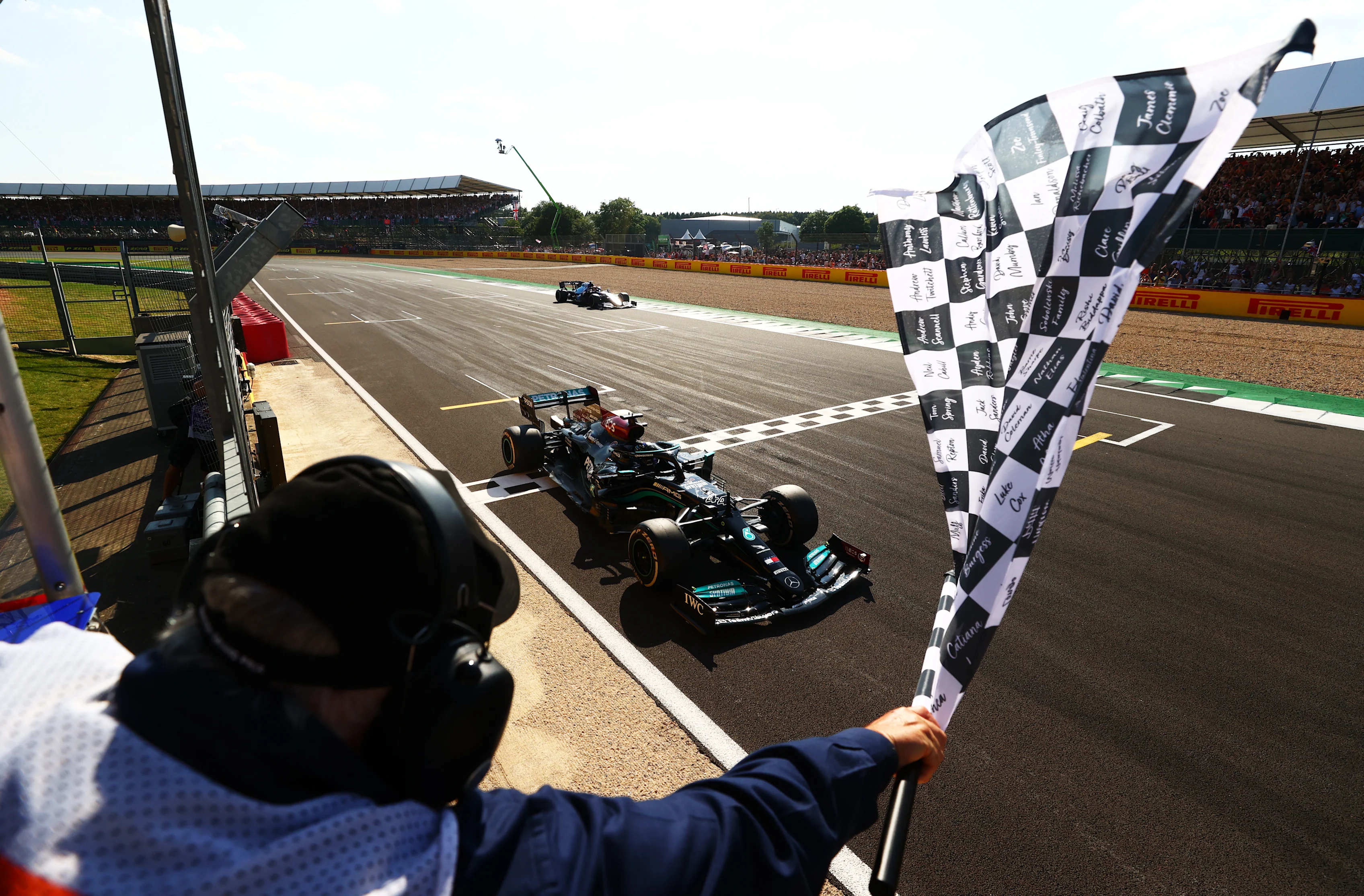 NORTHAMPTON, ENGLAND - JULY 18: Race winner Lewis Hamilton of Great Britain driving the (44)