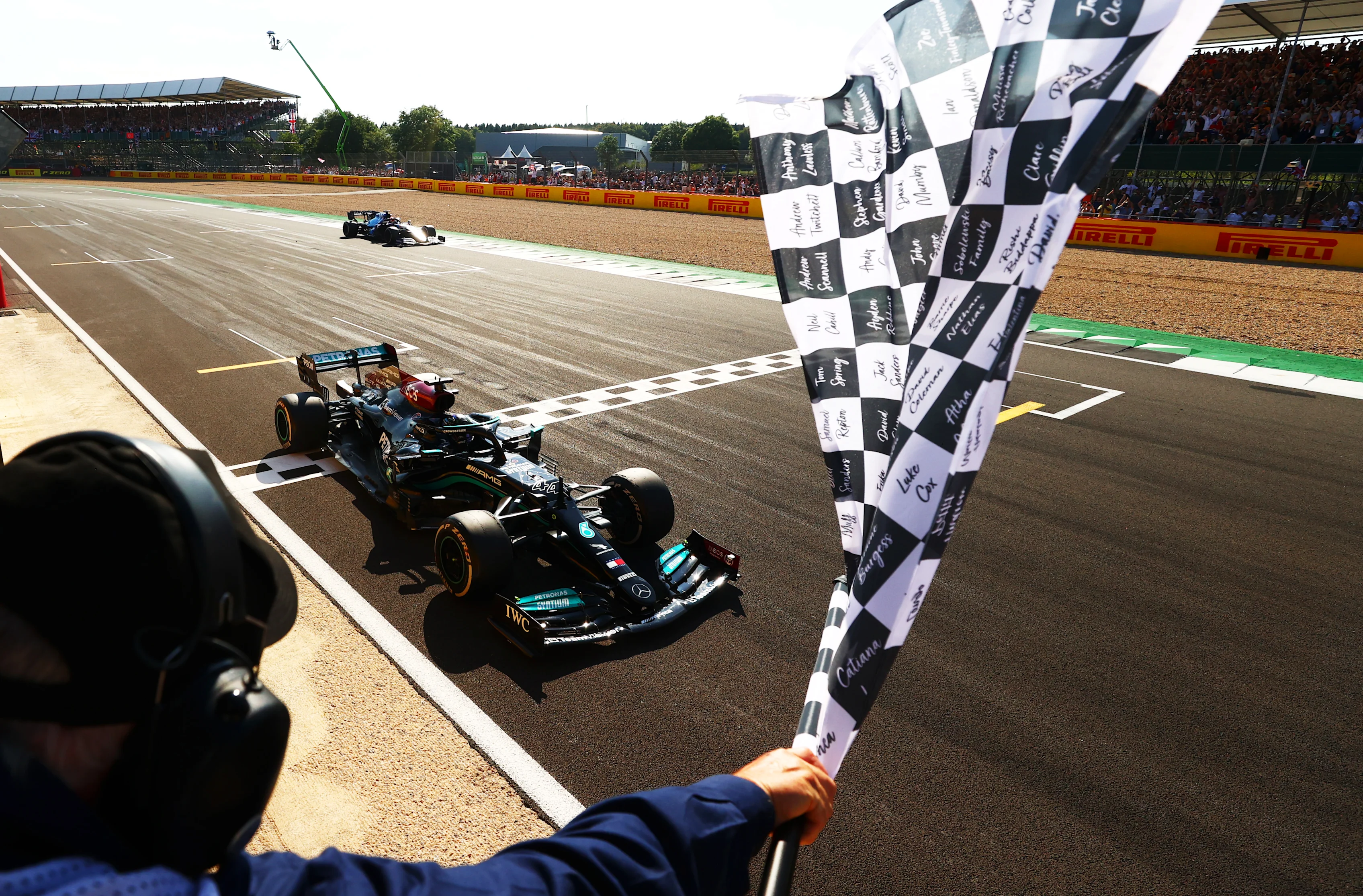 NORTHAMPTON, ENGLAND - JULY 18: Race winner Lewis Hamilton of Great Britain driving the (44)