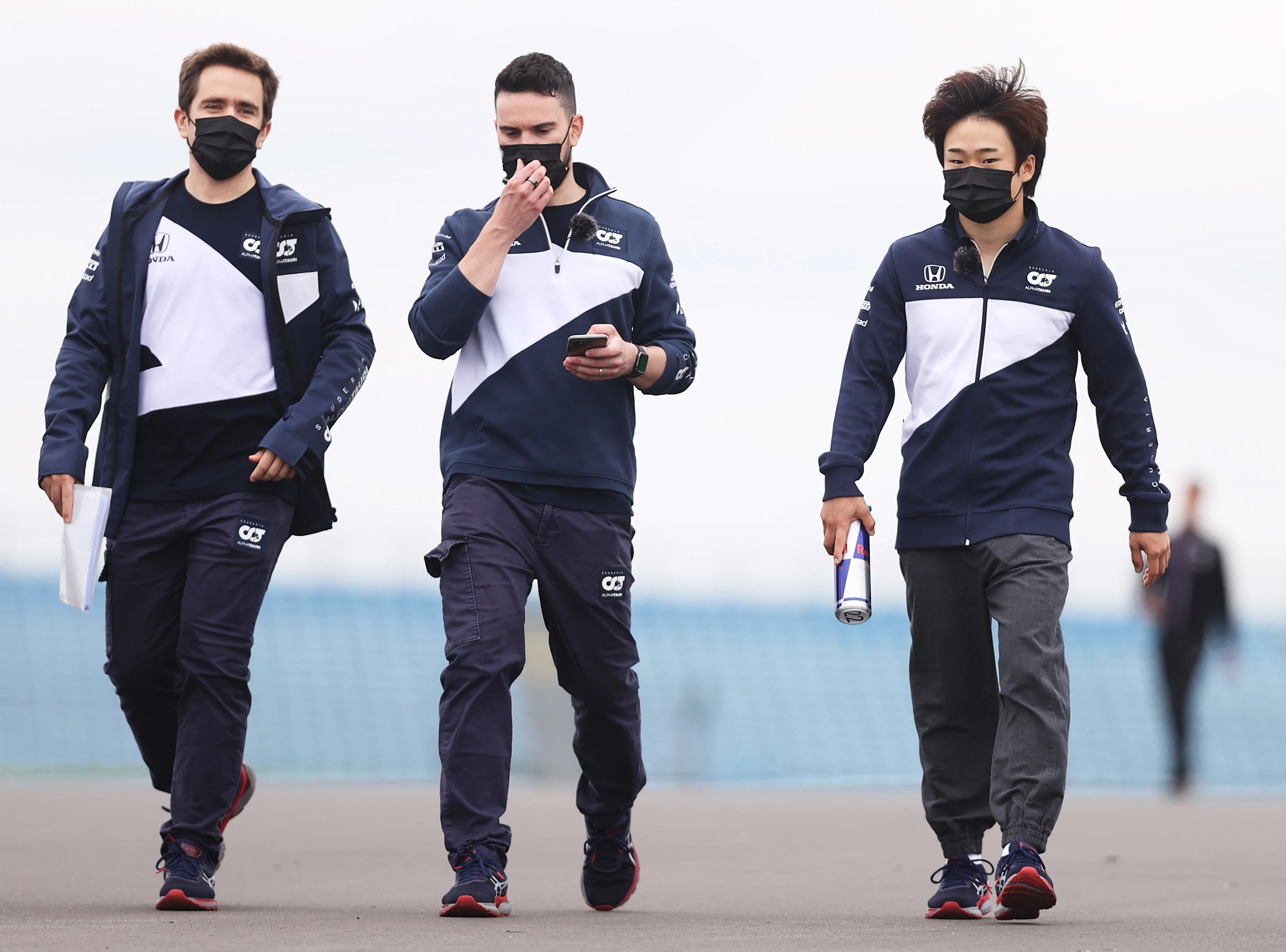 NORTHAMPTON, ENGLAND - JULY 15: Yuki Tsunoda of Japan and Scuderia AlphaTauri walks the track
