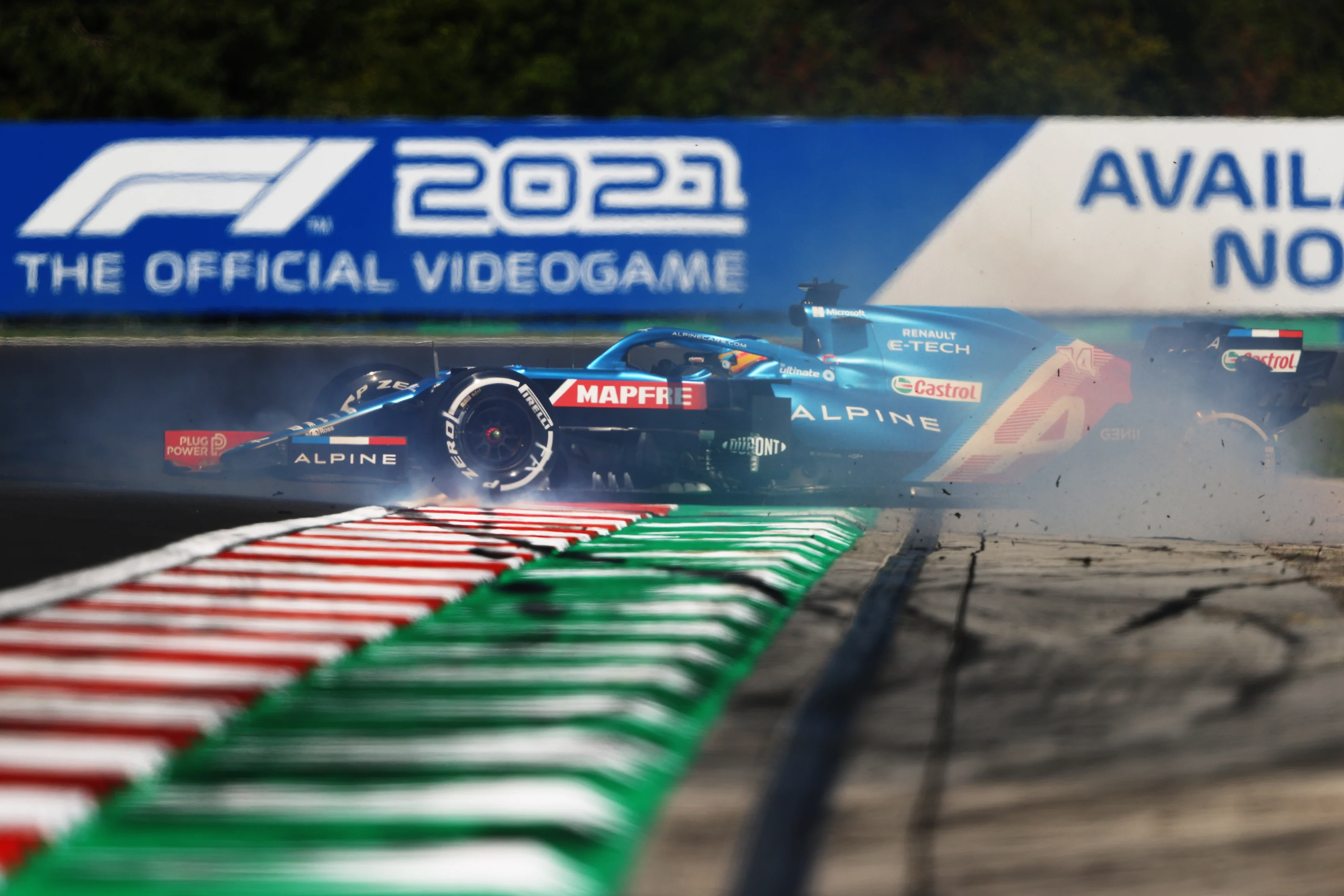 BUDAPEST, HUNGARY - JULY 30: Fernando Alonso of Spain driving the (14) Alpine A521 Renault spins during practice ahead of the F1 Grand Prix of Hungary at Hungaroring on July 30, 2021 in Budapest, Hungary. (Photo by Bryn Lennon/Getty Images)