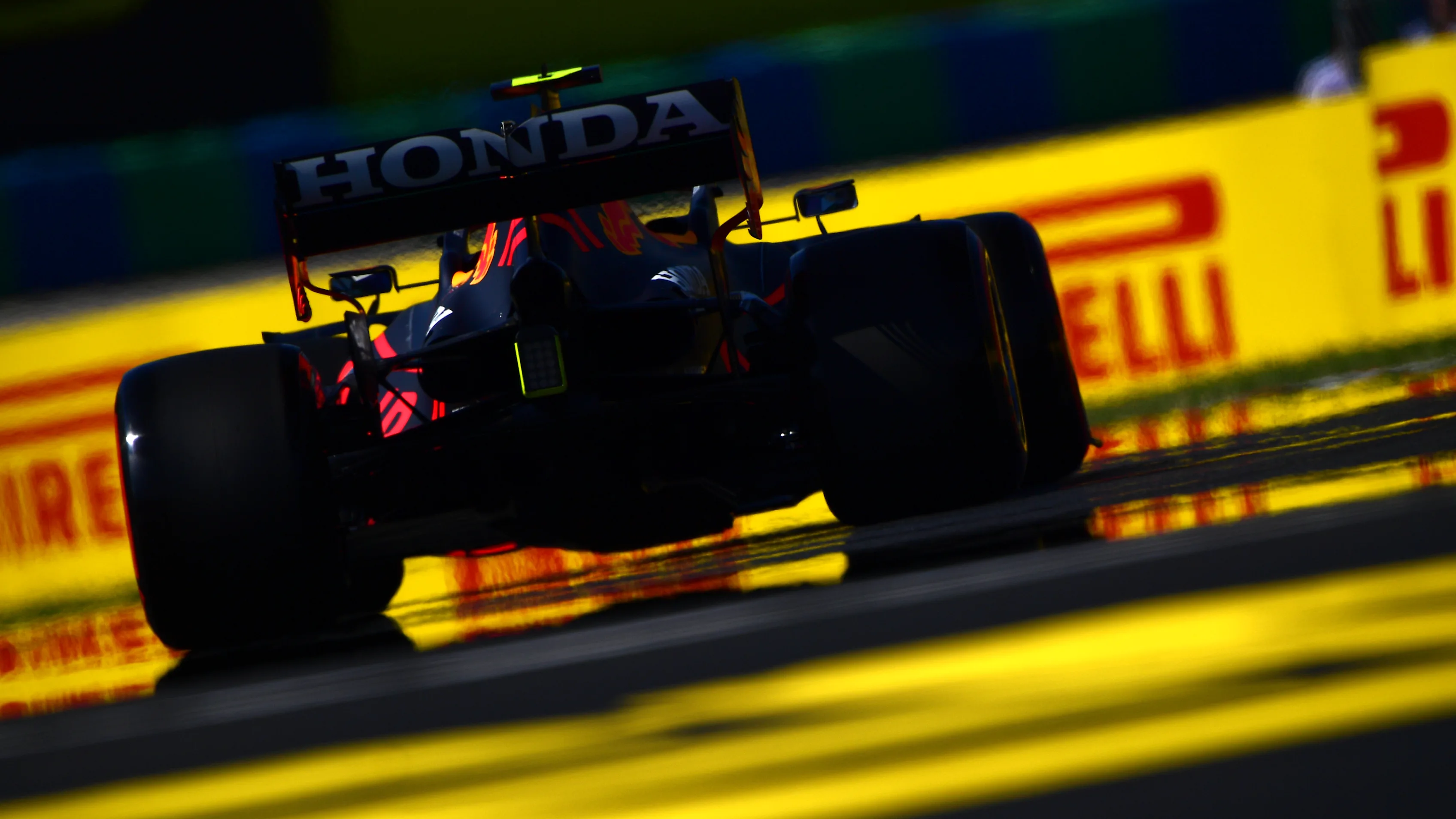 BUDAPEST, HUNGARY - JULY 30: Sergio Perez of Mexico driving the (11) Red Bull Racing RB16B Honda during practice ahead of the F1 Grand Prix of Hungary at Hungaroring on July 30, 2021 in Budapest, Hungary. (Photo by Mario Renzi - Formula 1/Formula 1 via Getty Images)