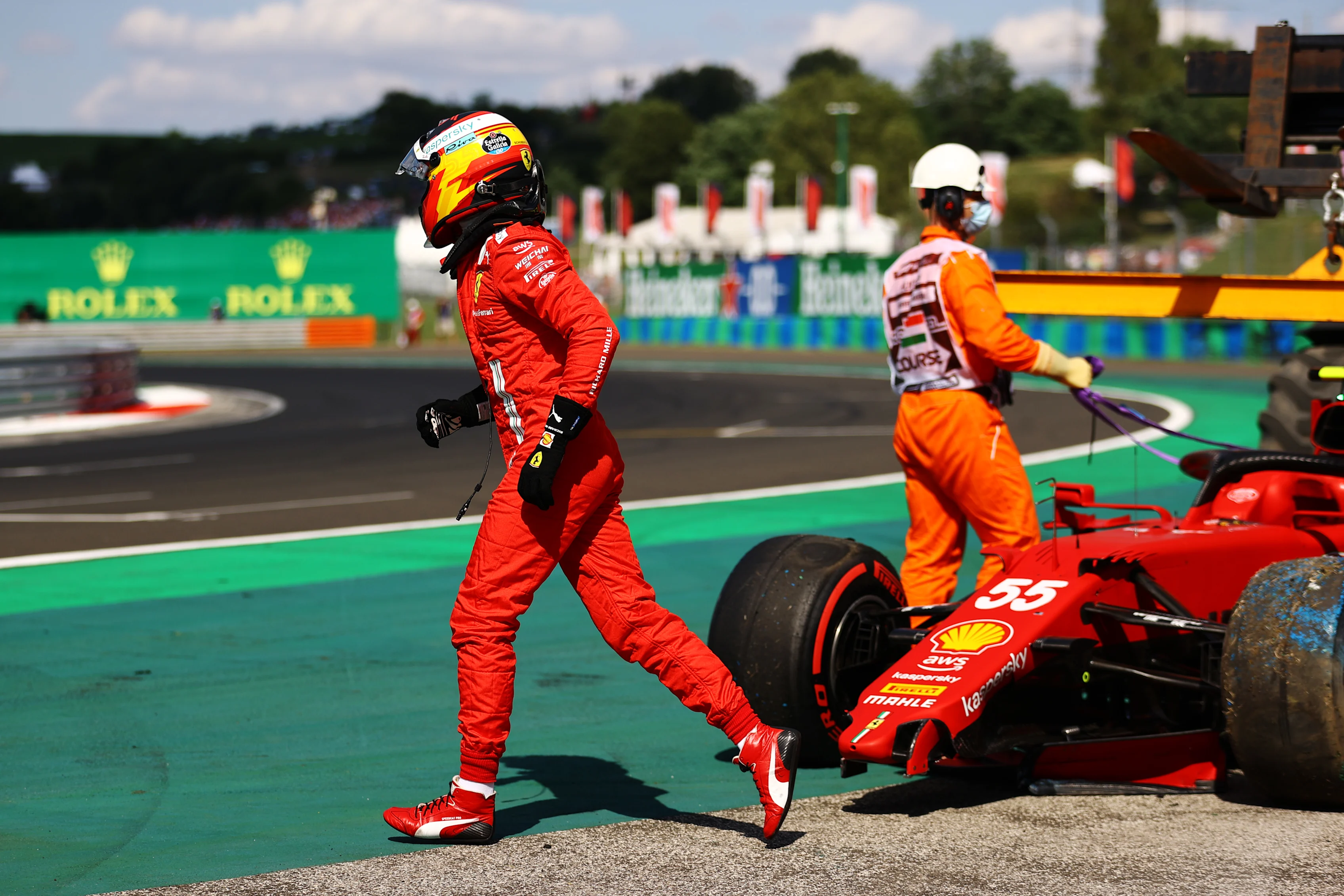 BUDAPEST, HUNGARY - JULY 31: Carlos Sainz of Spain driving the (55) Scuderia Ferrari SF21 walks