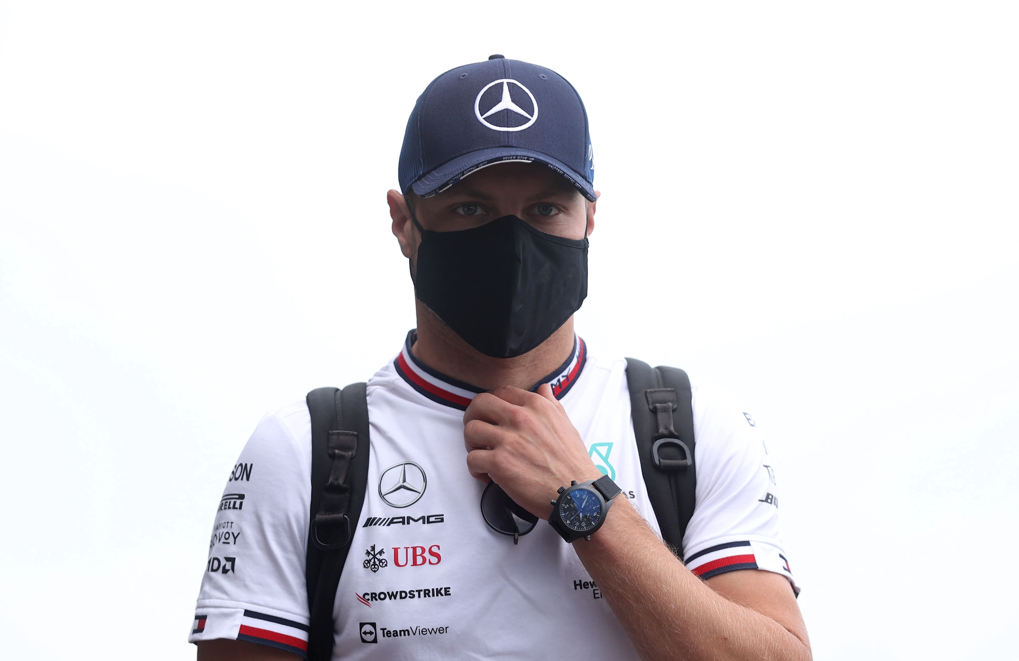 BUDAPEST, HUNGARY - AUGUST 01: Valtteri Bottas of Finland and Mercedes GP walks in the Paddock