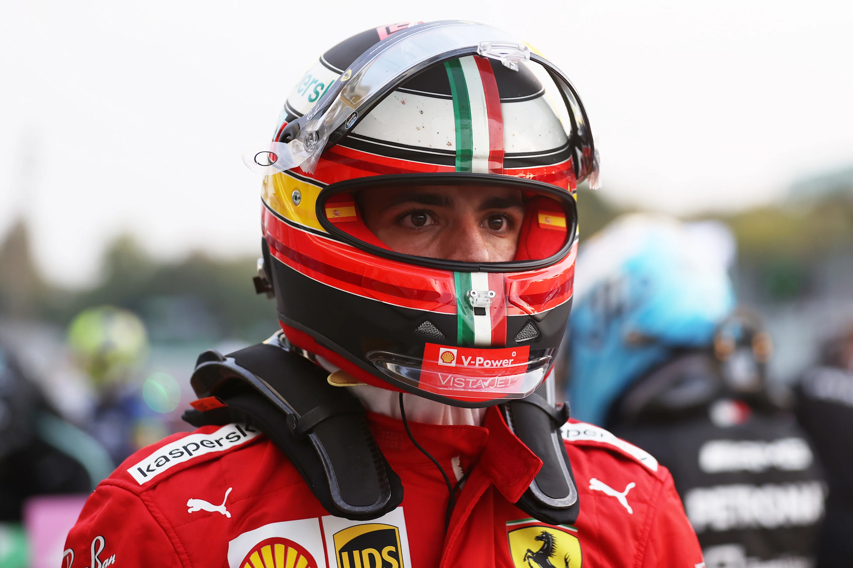 MONZA, ITALY - SEPTEMBER 10: Carlos Sainz of Spain and Ferrari walks in parc ferme during qualifying ahead of the F1 Grand Prix of Italy at Autodromo di Monza on September 10, 2021 in Monza, Italy. (Photo by Lars Baron/Getty Images)