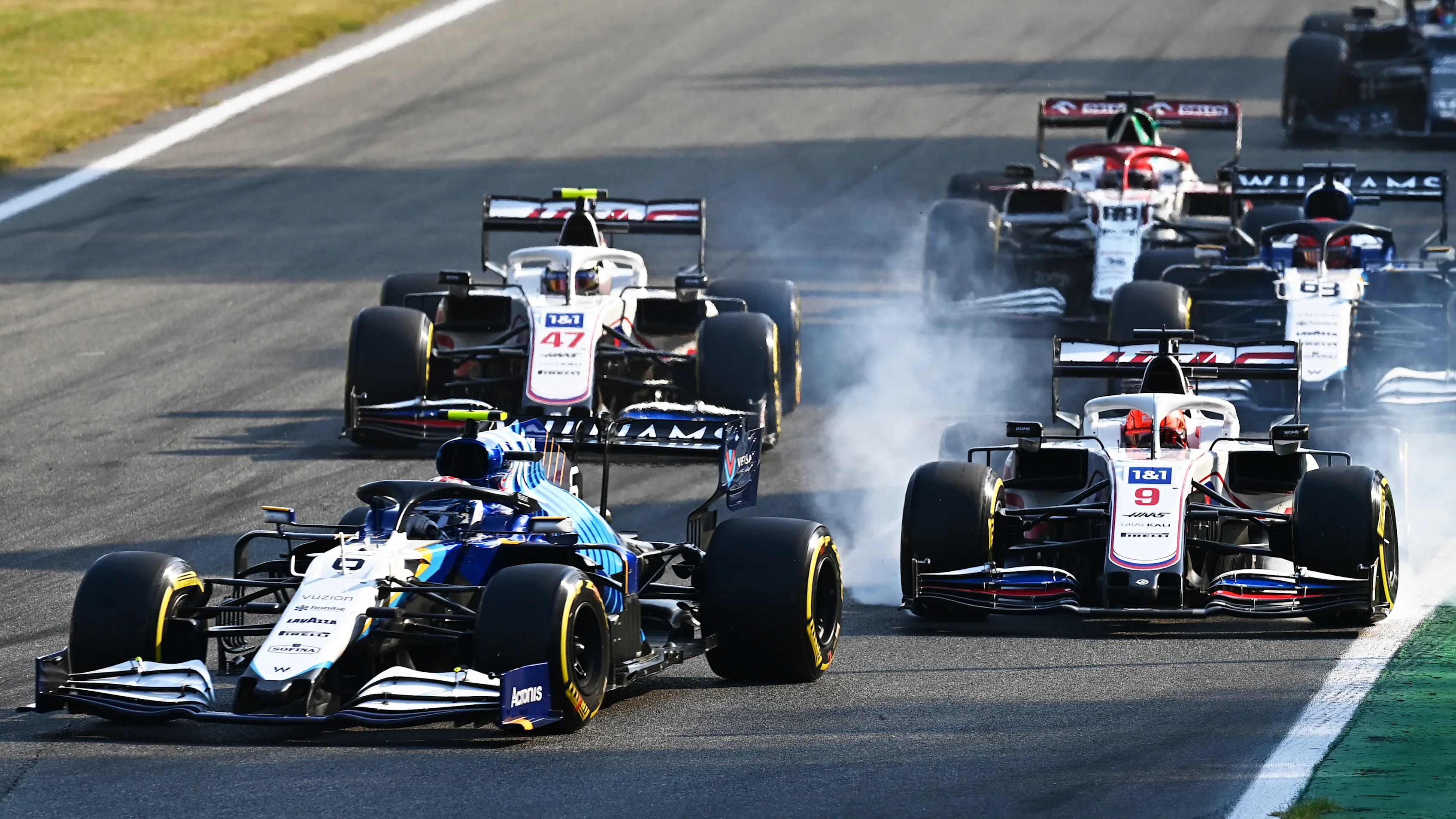 MONZA, ITALY - SEPTEMBER 11: Nicholas Latifi of Canada driving the (6) Williams Racing FW43B Mercedes leads Mick Schumacher of Germany driving the (47) Haas F1 Team VF-21 Ferrari during the Sprint ahead of the F1 Grand Prix of Italy at Autodromo di Monza on September 11, 2021 in Monza, Italy. (Photo by Clive Mason - Formula 1/Formula 1 via Getty Images)