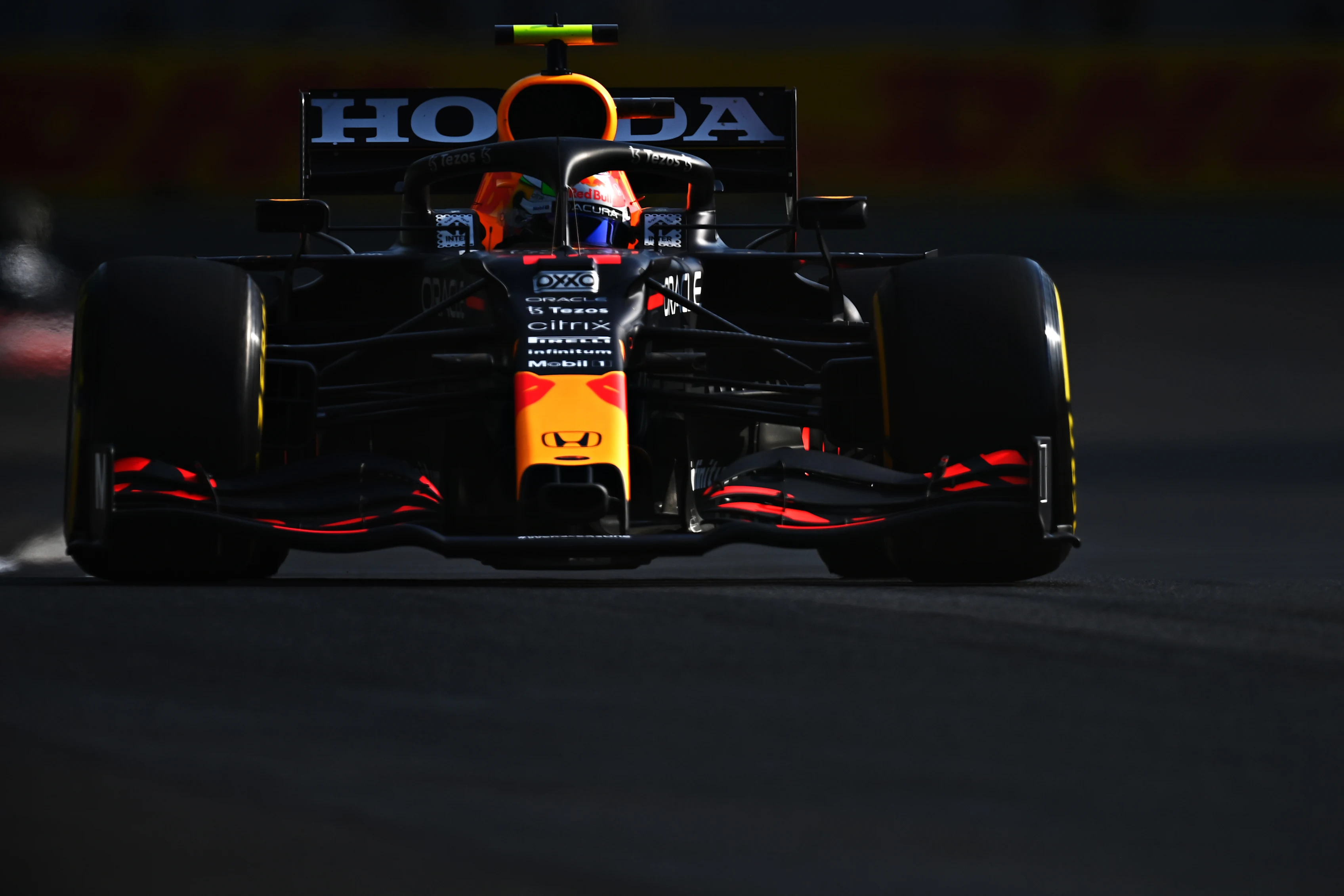 MEXICO CITY, MEXICO - NOVEMBER 05: Sergio Perez of Mexico driving the (11) Red Bull Racing RB16B Honda during practice ahead of the F1 Grand Prix of Mexico at Autodromo Hermanos Rodriguez on November 05, 2021 in Mexico City, Mexico. (Photo by Clive Mason/Getty Images)