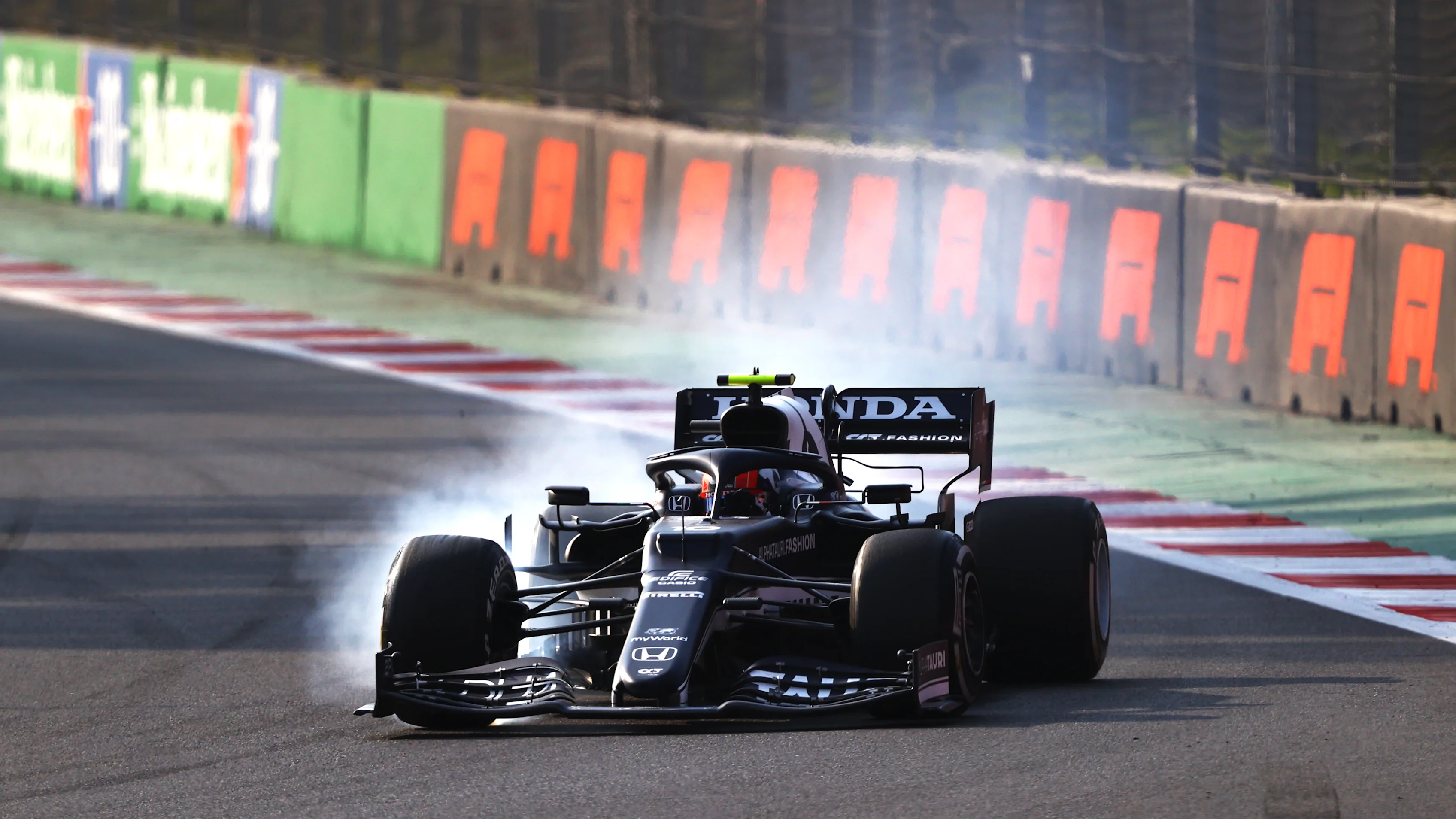 MEXICO CITY, MEXICO - NOVEMBER 05: Pierre Gasly of France driving the (10) Scuderia AlphaTauri AT02 Honda locks a wheel under braking during practice ahead of the F1 Grand Prix of Mexico at Autodromo Hermanos Rodriguez on November 05, 2021 in Mexico City, Mexico. (Photo by Bryn Lennon - Formula 1/Formula 1 via Getty Images)