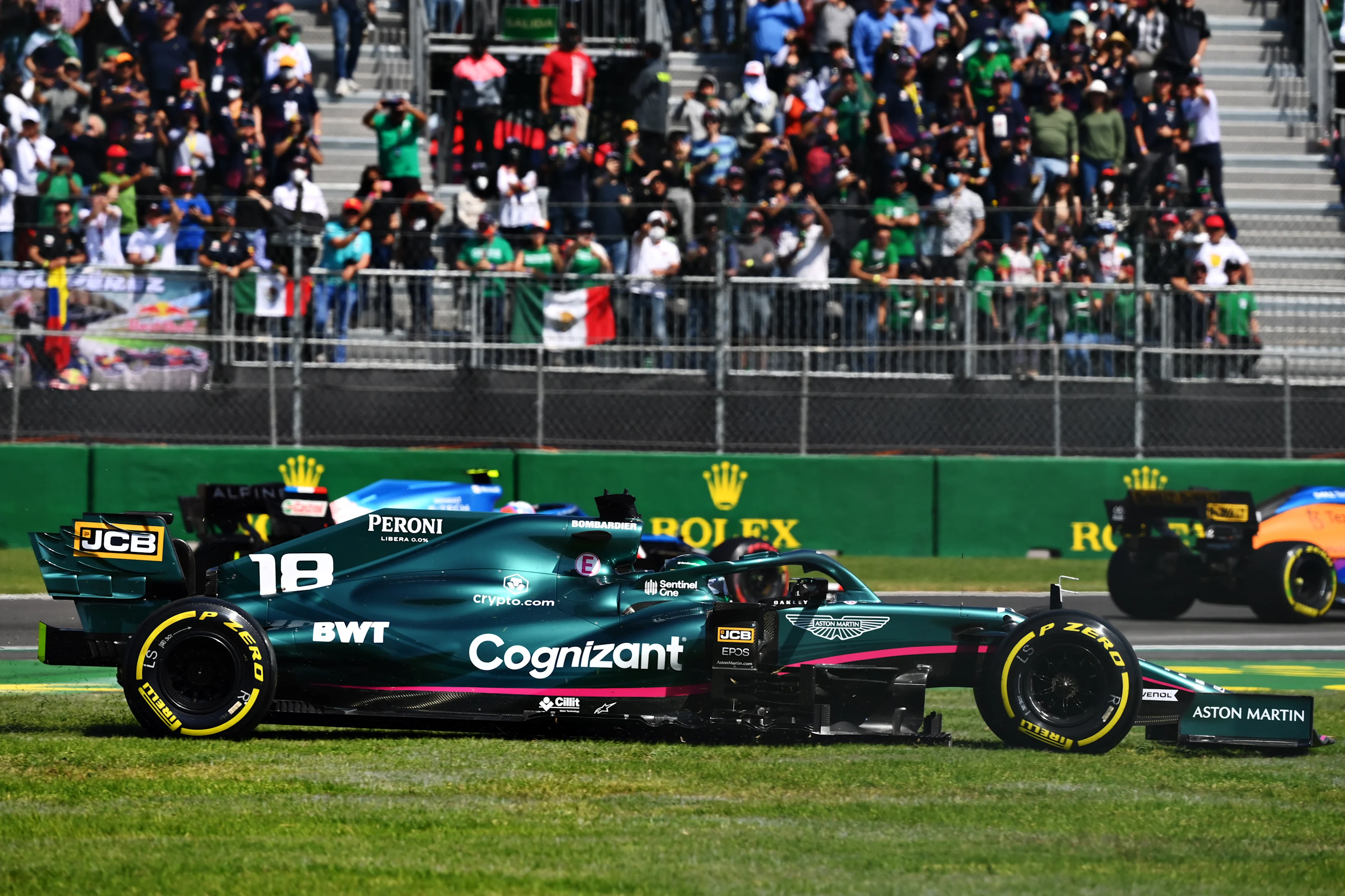 MEXICO CITY, MEXICO - NOVEMBER 07: Lance Stroll of Canada driving the (18) Aston Martin AMR21 Mercedes runs wide during the F1 Grand Prix of Mexico at Autodromo Hermanos Rodriguez on November 07, 2021 in Mexico City, Mexico. (Photo by Clive Mason/Getty Images)