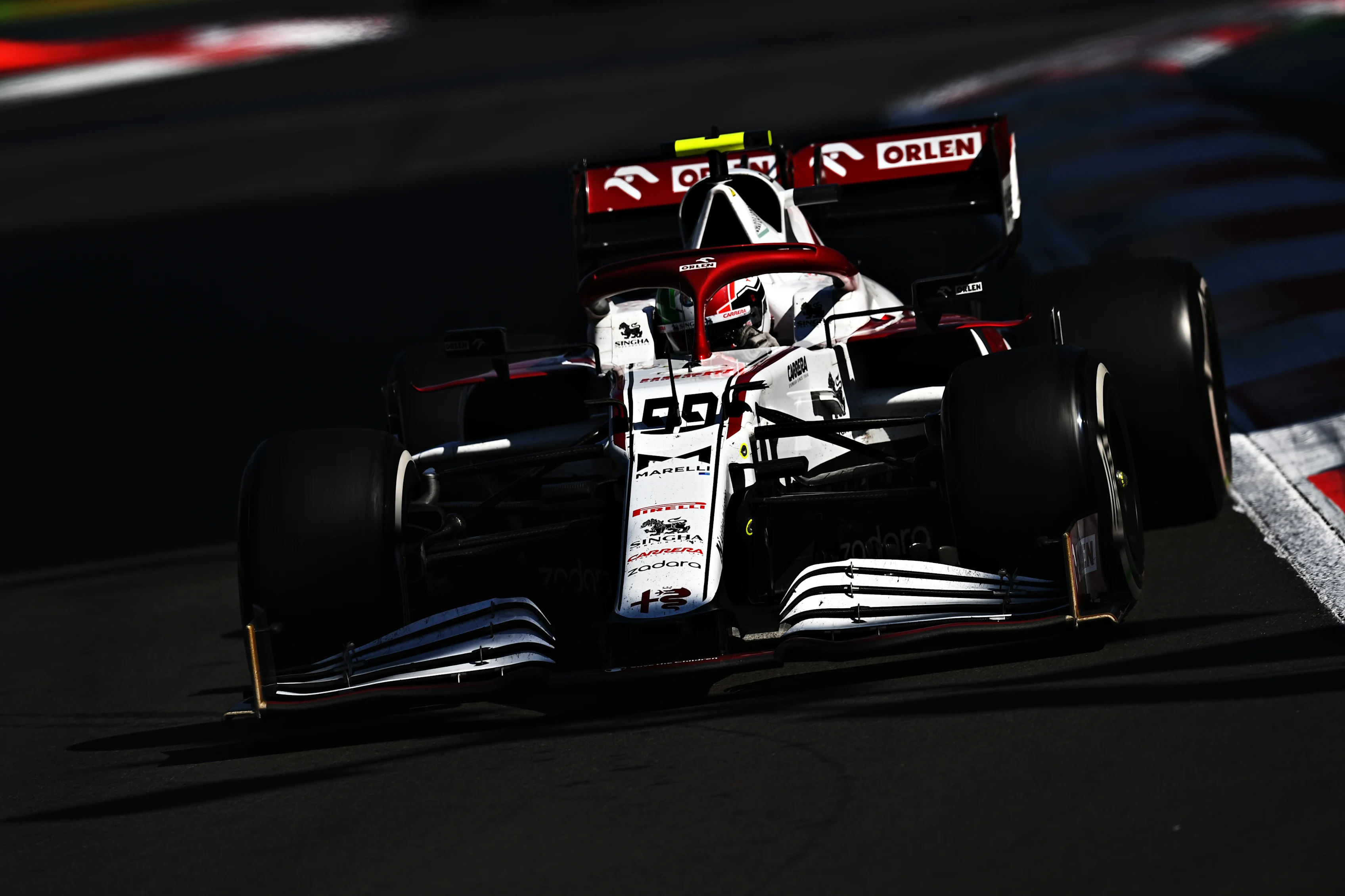 MEXICO CITY, MEXICO - NOVEMBER 07: Antonio Giovinazzi of Italy driving the (99) Alfa Romeo Racing C41 Ferrari during the F1 Grand Prix of Mexico at Autodromo Hermanos Rodriguez on November 07, 2021 in Mexico City, Mexico. (Photo by Clive Mason/Getty Images)