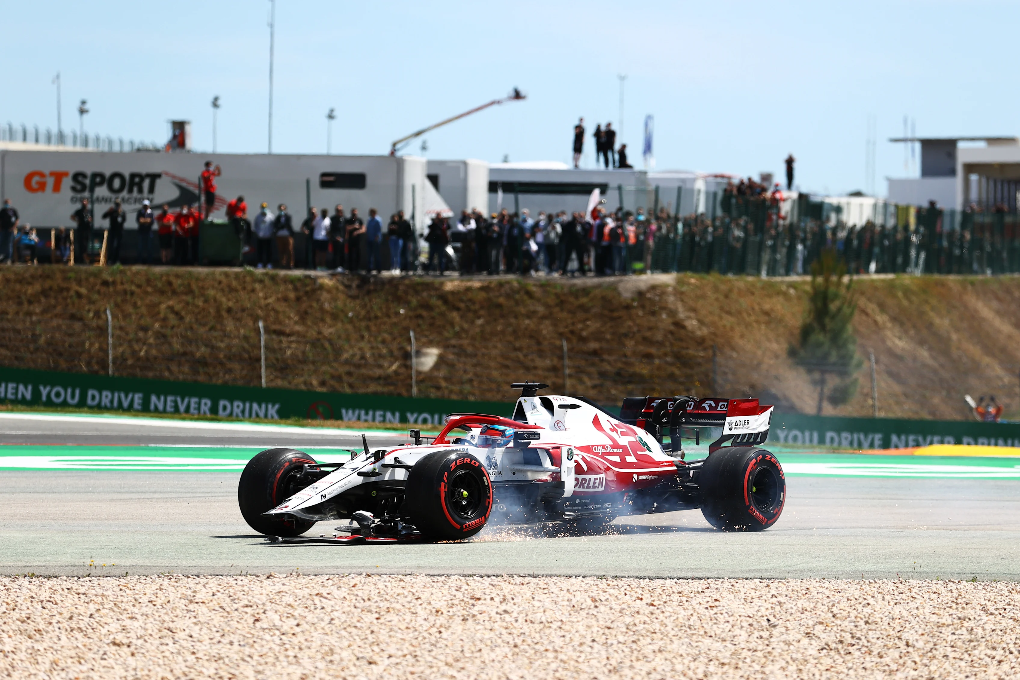 PORTIMAO, PORTUGAL - MAY 02: Kimi Raikkonen of Finland driving the (7) Alfa Romeo Racing C41 Ferrari runs wide with a broken front wing during the F1 Grand Prix of Portugal at Autodromo Internacional Do Algarve on May 02, 2021 in Portimao, Portugal. (Photo by Bryn Lennon/Getty Images)