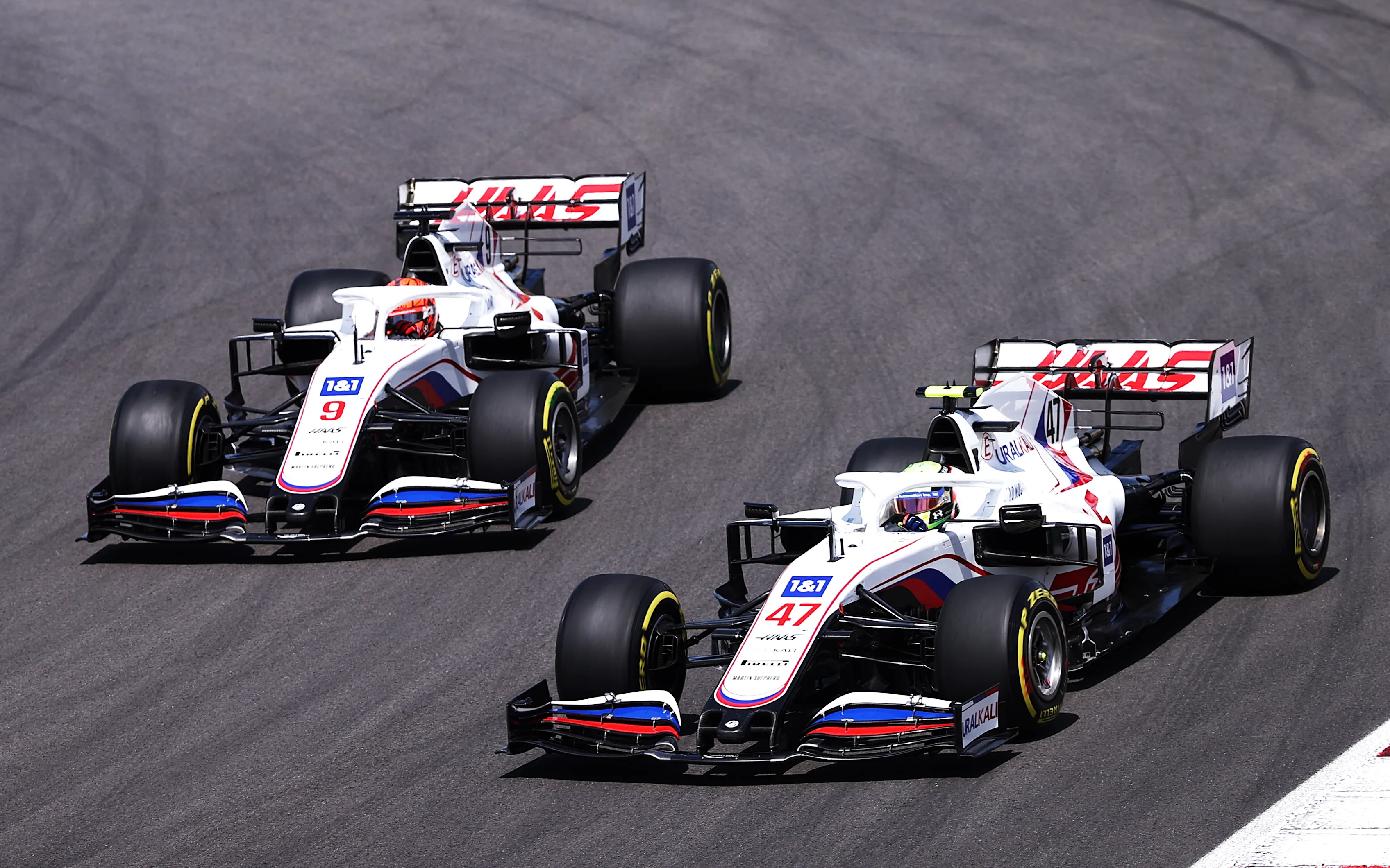 PORTIMAO, PORTUGAL - MAY 02: Mick Schumacher of Germany driving the (47) Haas F1 Team VF-21 Ferrari leads Nikita Mazepin of Russia driving the (9) Haas F1 Team VF-21 Ferrari on track during the F1 Grand Prix of Portugal at Autodromo Internacional Do Algarve on May 02, 2021 in Portimao, Portugal. (Photo by Lars Baron/Getty Images)