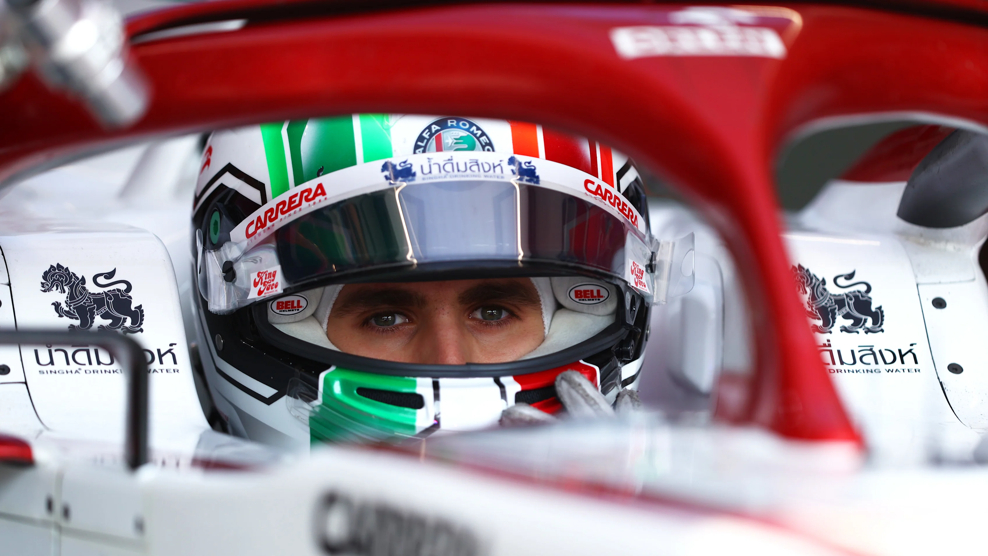 DOHA, QATAR - NOVEMBER 19: Antonio Giovinazzi of Italy and Alfa Romeo Racing prepares to drive in the garage during practice ahead of the F1 Grand Prix of Qatar at Losail International Circuit on November 19, 2021 in Doha, Qatar. (Photo by Dan Istitene - Formula 1/Formula 1 via Getty Images)