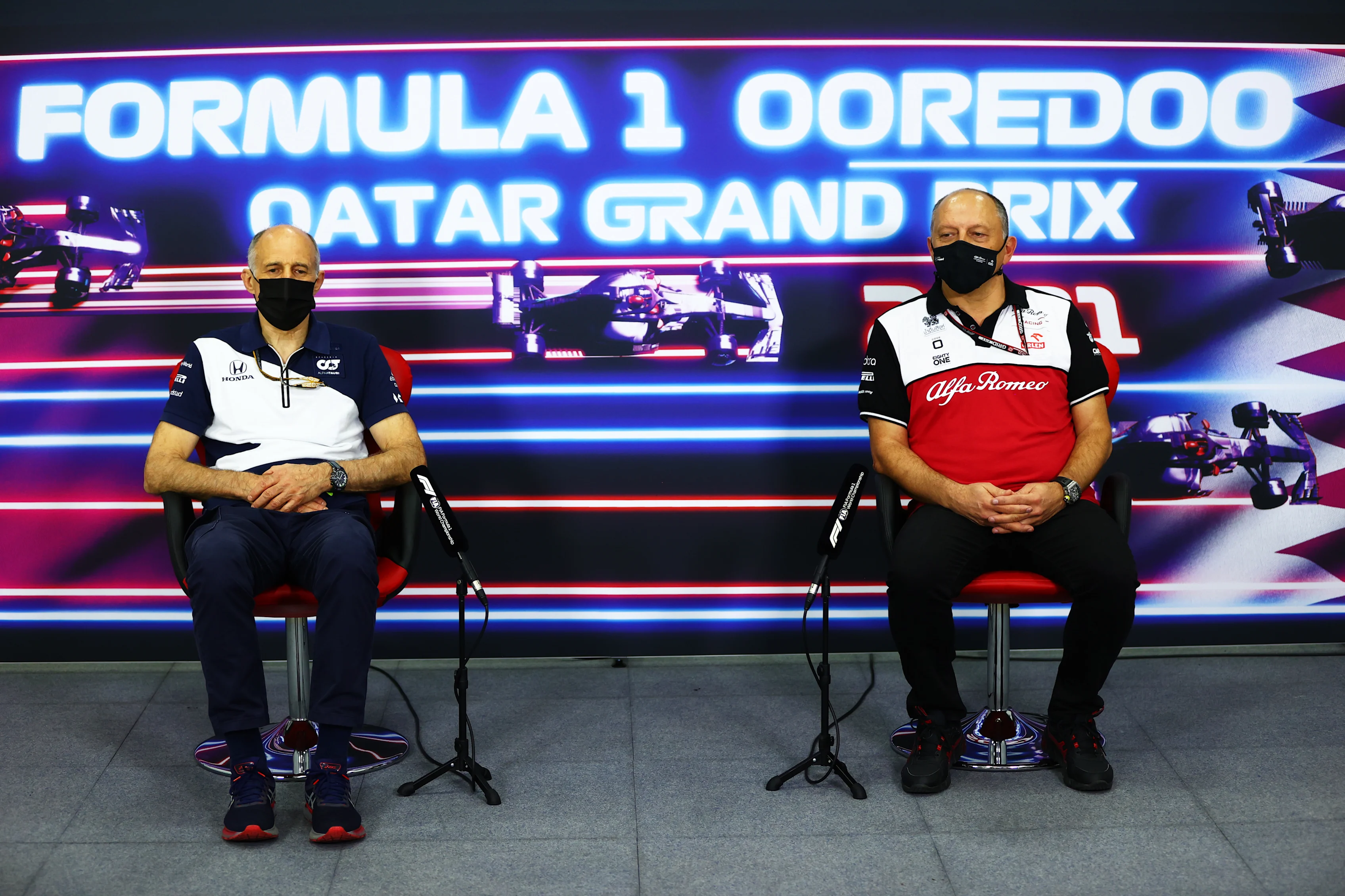DOHA, QATAR - NOVEMBER 19: Scuderia AlphaTauri Team Principal Franz Tost and Alfa Romeo Racing Team Principal Frederic Vasseur talk in the Team Principals Press Conference during practice ahead of the F1 Grand Prix of Qatar at Losail International Circuit on November 19, 2021 in Doha, Qatar. (Photo by Dan Istitene/Getty Images)