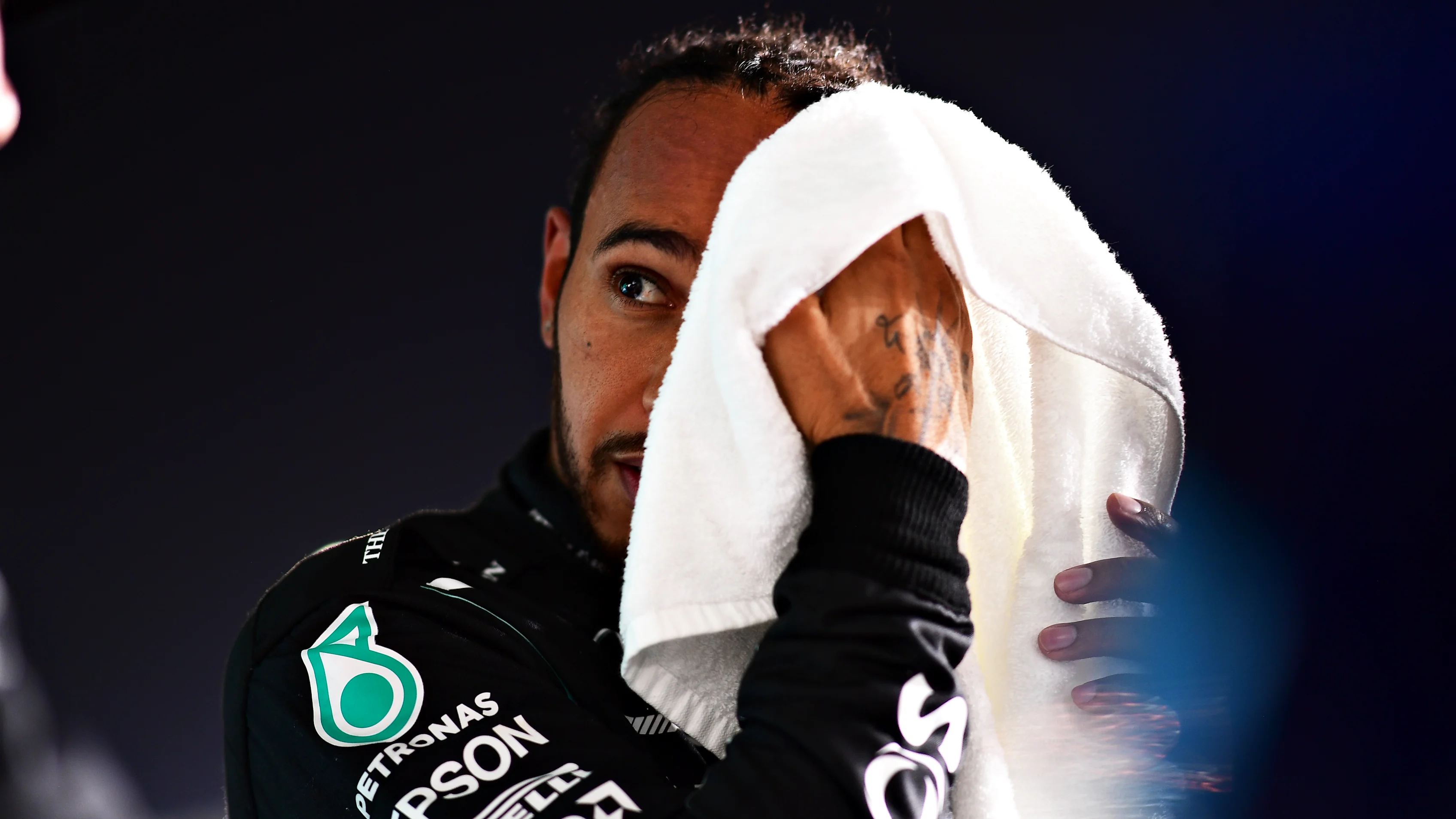 DOHA, QATAR - NOVEMBER 20: Pole position qualifier Lewis Hamilton of Great Britain and Mercedes GP looks on in parc ferme after qualifying ahead of the F1 Grand Prix of Qatar at Losail International Circuit on November 20, 2021 in Doha, Qatar. (Photo by Mario Renzi - Formula 1/Formula 1 via Getty Images)