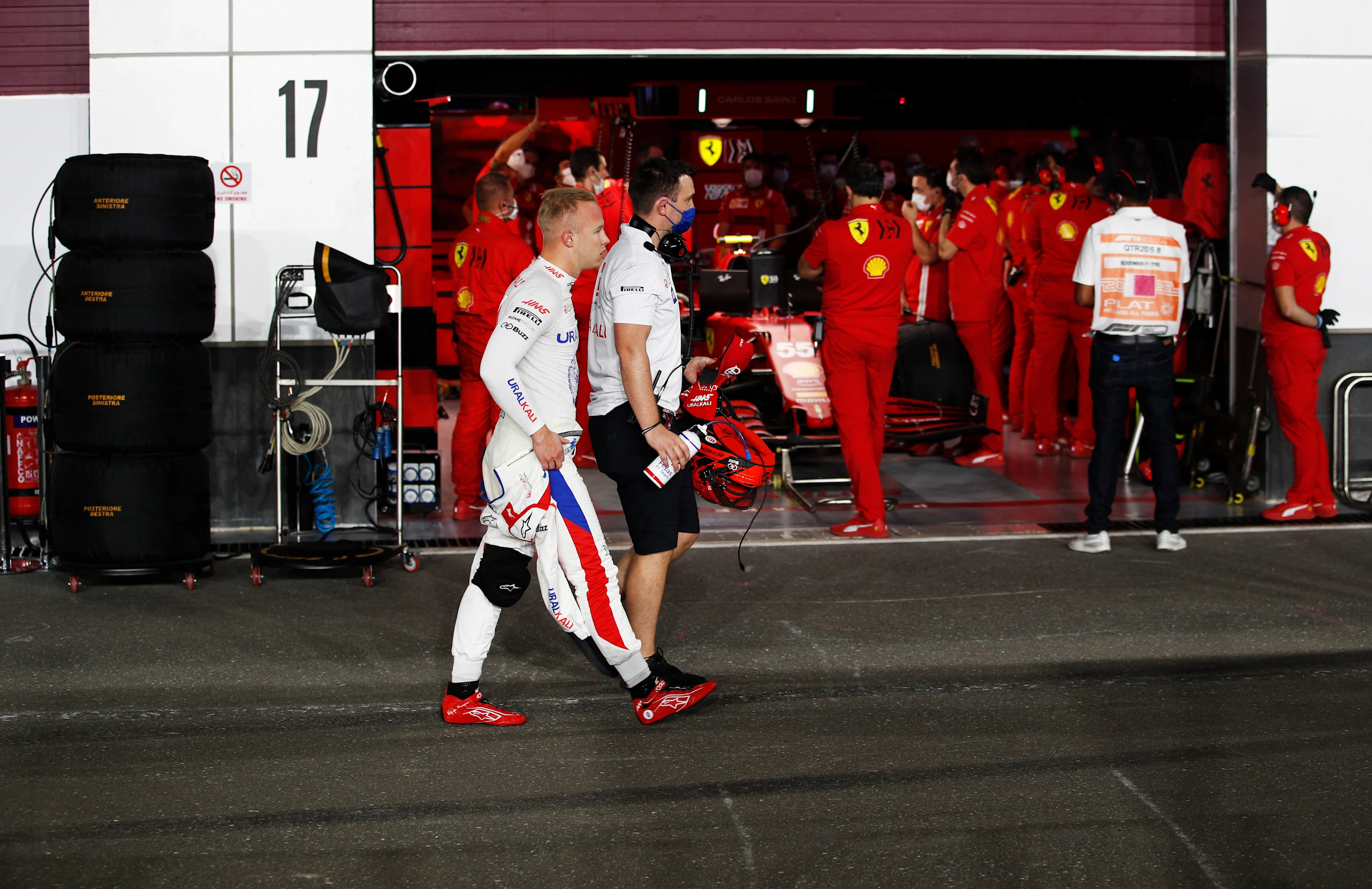 DOHA, QATAR - NOVEMBER 20: Nikita Mazepin of Russia and Haas F1 walksin the Pitlane  during qualifying ahead of the F1 Grand Prix of Qatar at Losail International Circuit on November 20, 2021 in Doha, Qatar. (Photo by Hamad I Mohammed - Pool/Getty Images)