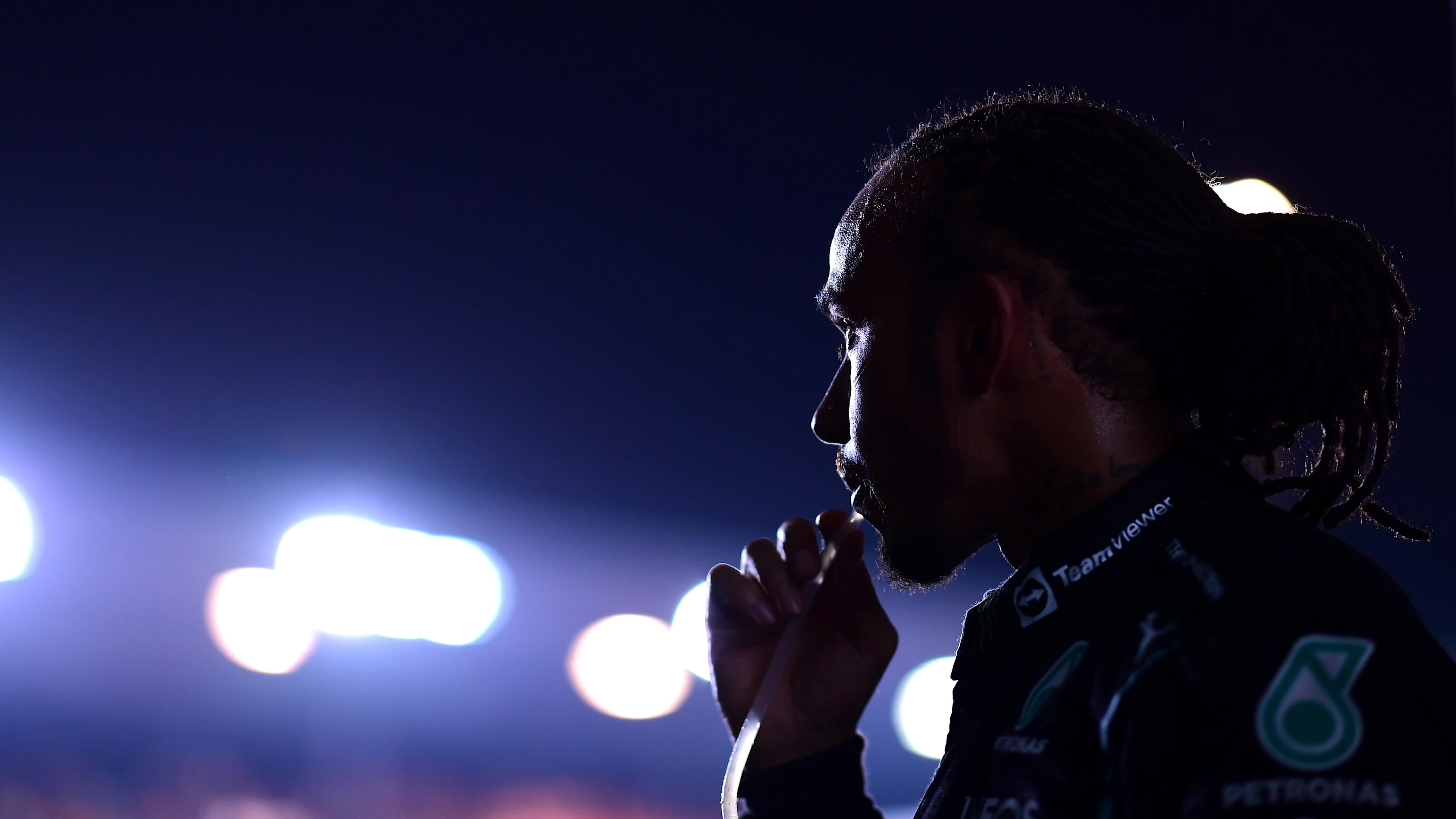 DOHA, QATAR - NOVEMBER 21: Race winner Lewis Hamilton of Great Britain and Mercedes GP looks on in