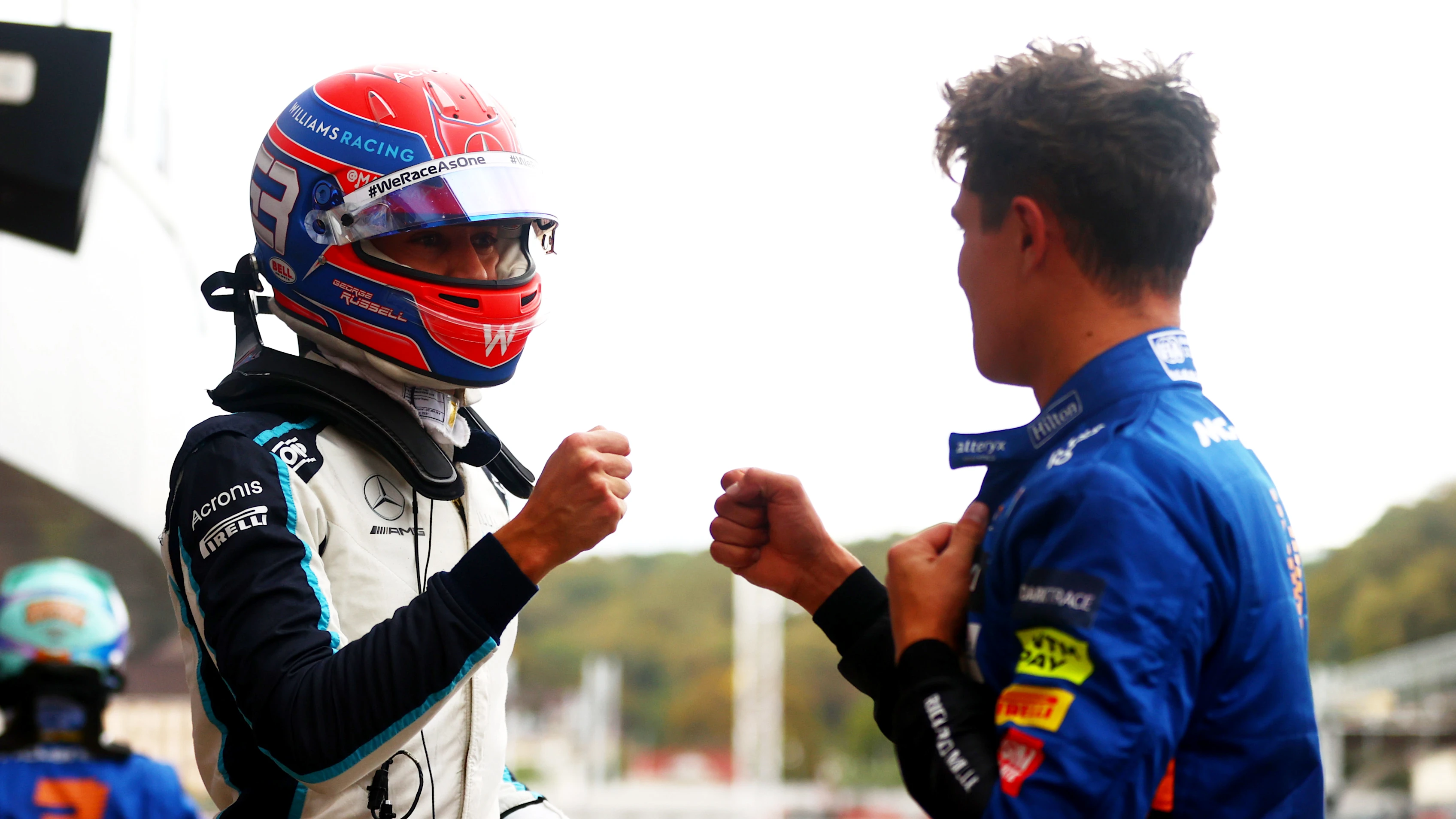 SOCHI, RUSSIA - SEPTEMBER 25: Pole position qualifier Lando Norris of Great Britain and McLaren F1 talks with third place qualifier George Russell of Great Britain and Williams in parc ferme during qualifying ahead of the F1 Grand Prix of Russia at Sochi Autodrom on September 25, 2021 in Sochi, Russia. (Photo by Dan Istitene - Formula 1/Formula 1 via Getty Images)