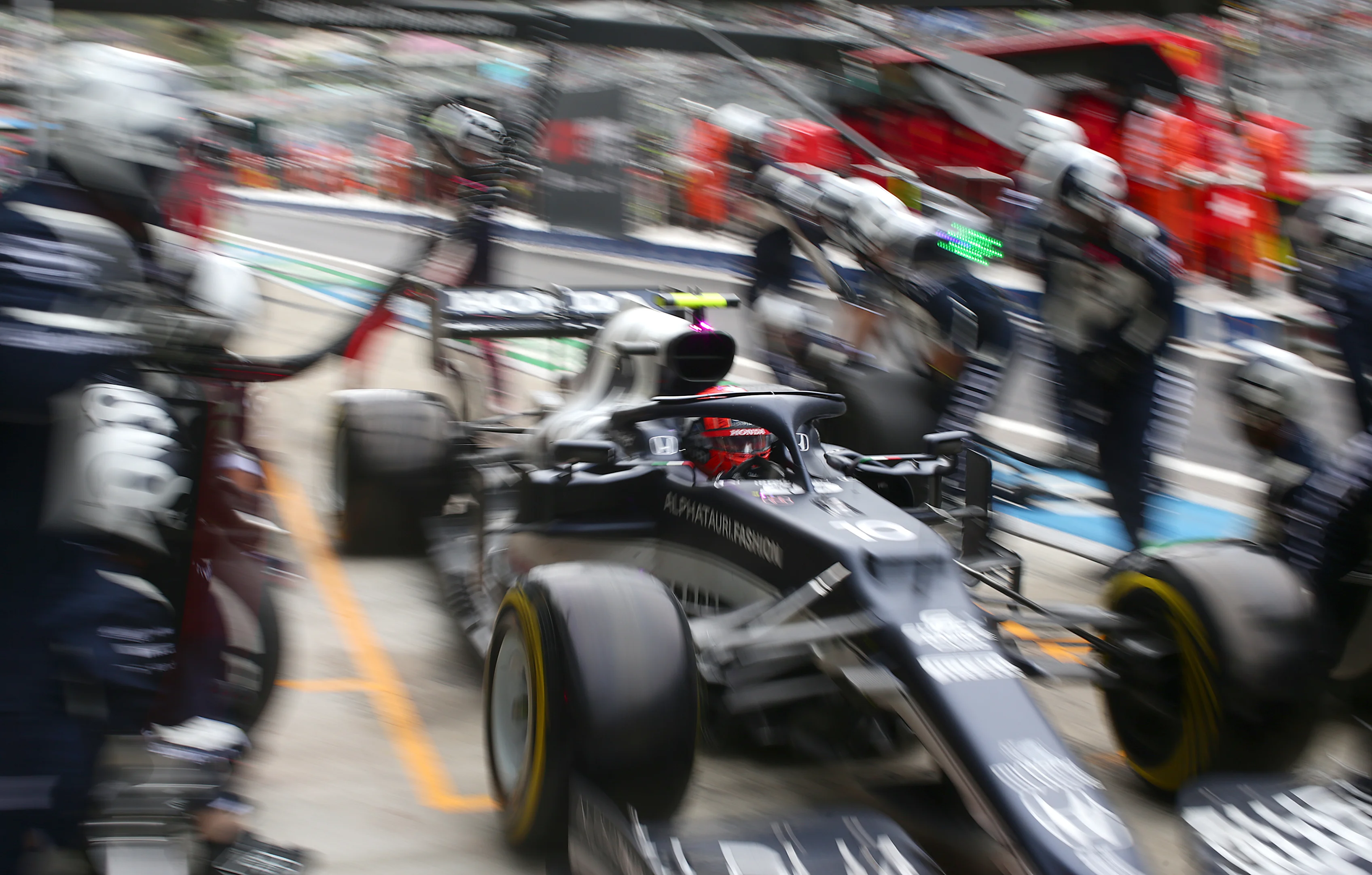 SOCHI, RUSSIA - SEPTEMBER 26: Pierre Gasly of France driving the (10) Scuderia AlphaTauri AT02 Honda makes a pitstop during the F1 Grand Prix of Russia at Sochi Autodrom on September 26, 2021 in Sochi, Russia. (Photo by Peter Fox/Getty Images)