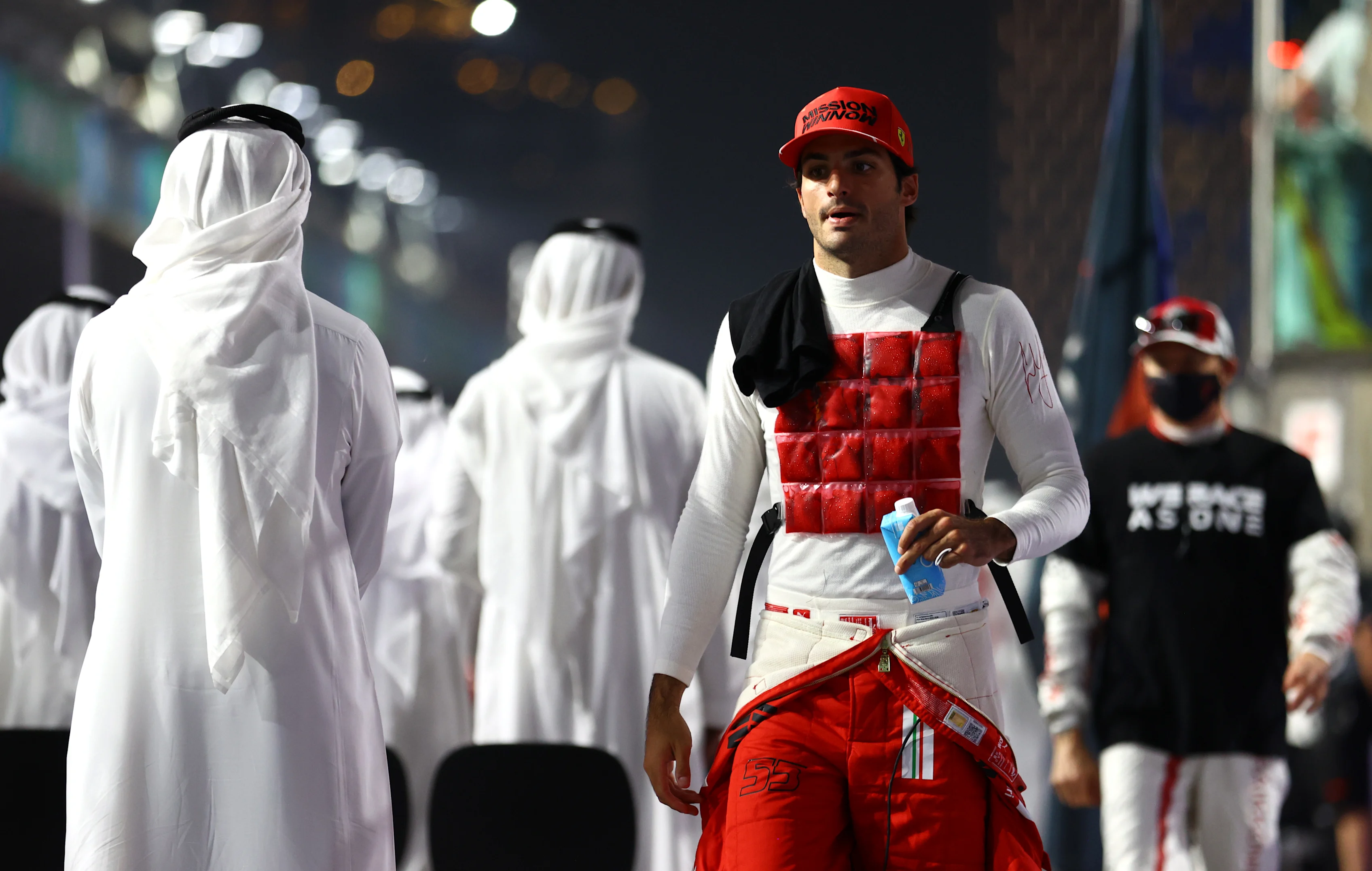 JEDDAH, SAUDI ARABIA - DECEMBER 05: Carlos Sainz of Spain and Ferrari prepares to drive on the grid during the F1 Grand Prix of Saudi Arabia at Jeddah Corniche Circuit on December 05, 2021 in Jeddah, Saudi Arabia. (Photo by Bryn Lennon - Formula 1/Formula 1 via Getty Images)