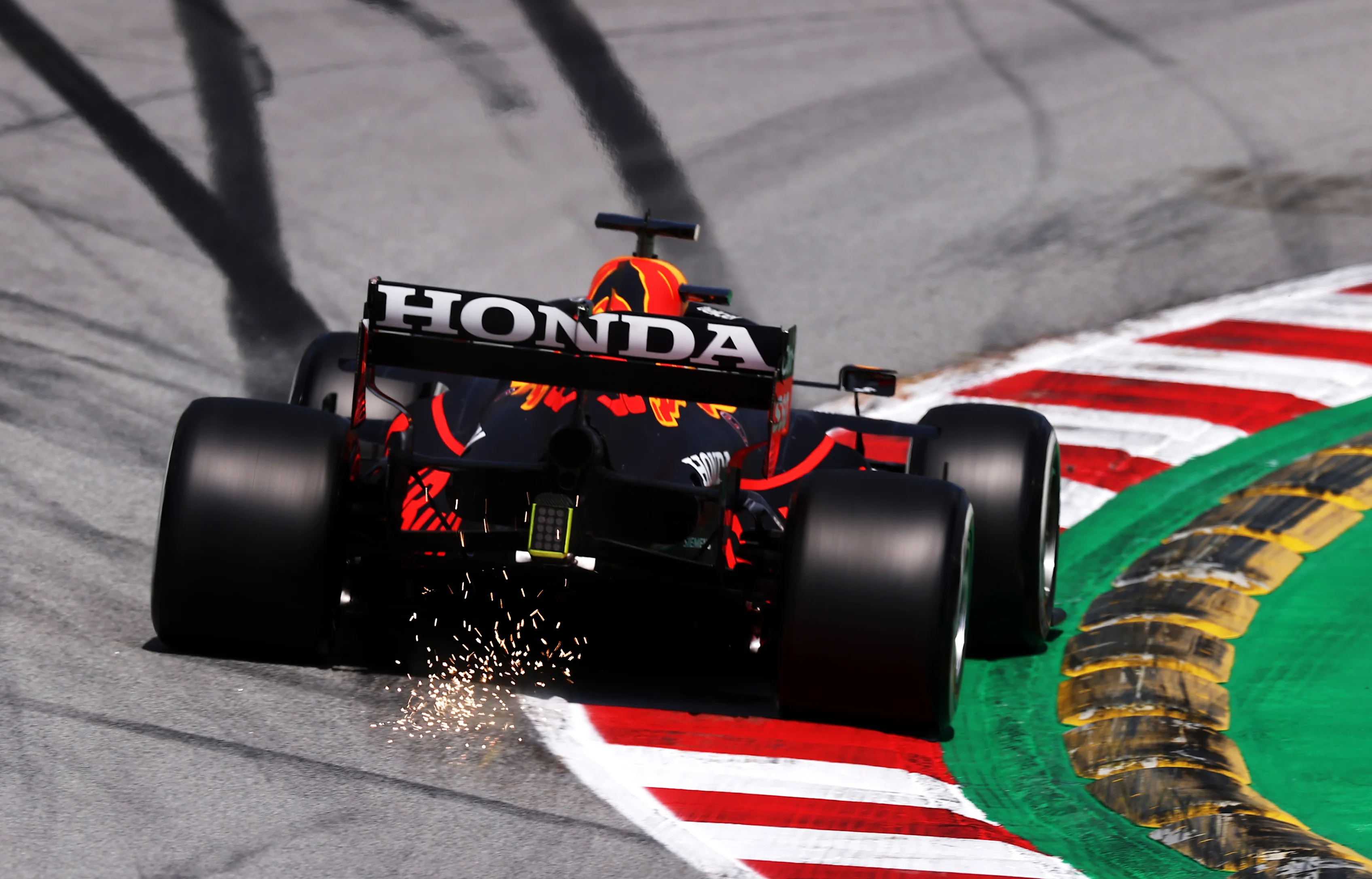 BARCELONA, SPAIN - MAY 07: Sparks fly behind the car of Max Verstappen of the Netherlands driving
