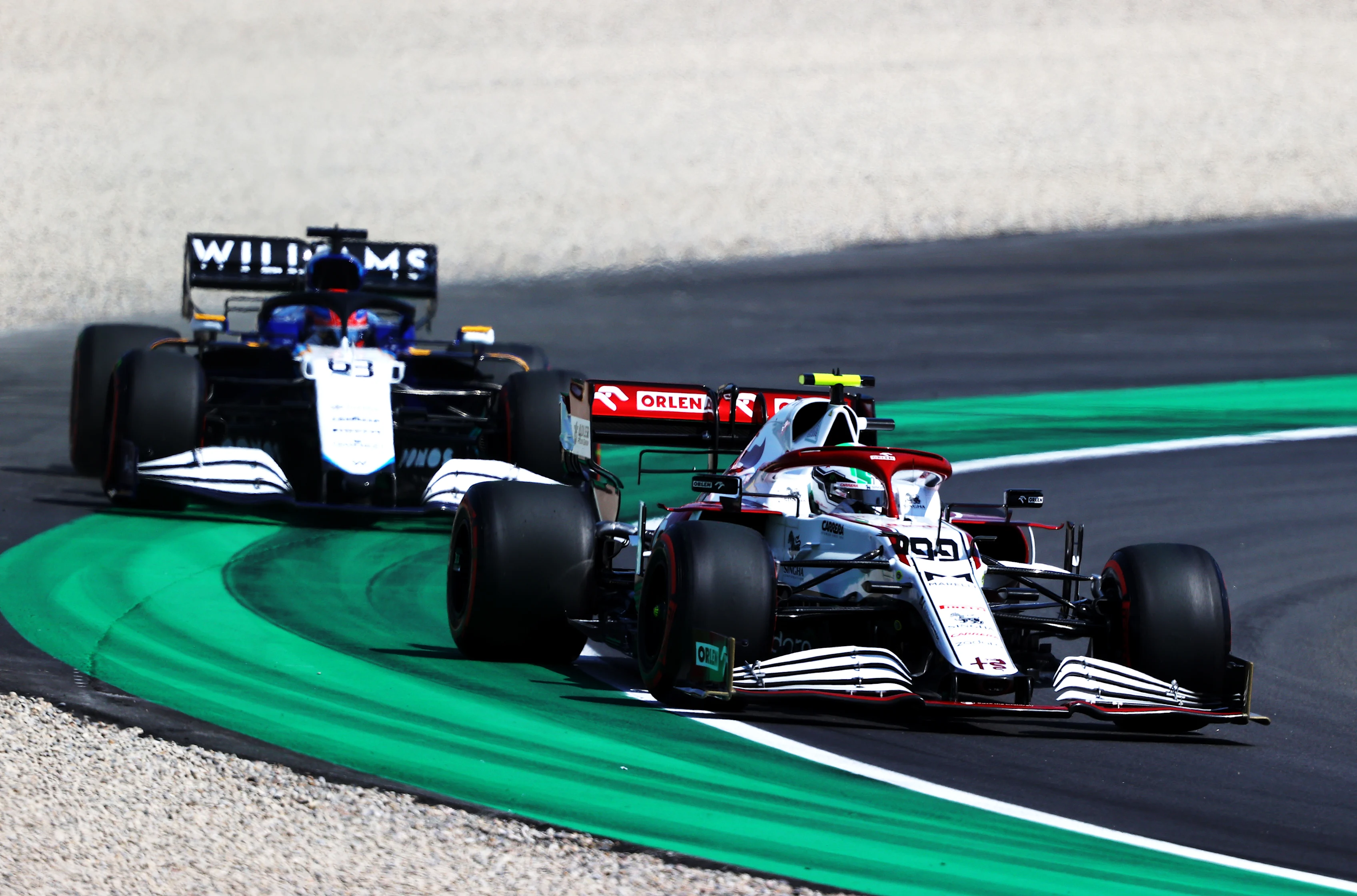 BARCELONA, SPAIN - MAY 07: Antonio Giovinazzi of Italy driving the (99) Alfa Romeo Racing C41 Ferrari leads George Russell of Great Britain driving the (63) Williams Racing FW43B Mercedes during practice for the F1 Grand Prix of Spain at Circuit de Barcelona-Catalunya on May 07, 2021 in Barcelona, Spain. (Photo by Bryn Lennon/Getty Images)