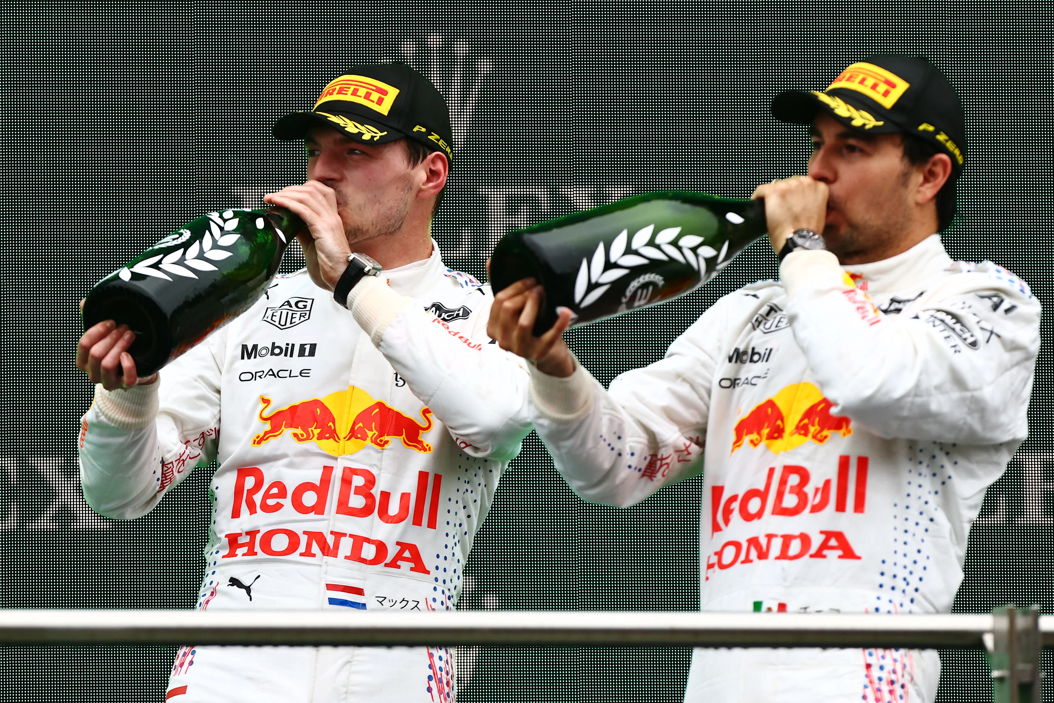 ISTANBUL, TURKEY - OCTOBER 10: Second placed Max Verstappen of Netherlands and Red Bull Racing and third placed Sergio Perez of Mexico and Red Bull Racing celebrate on the podiumduring the F1 Grand Prix of Turkey at Intercity Istanbul Park on October 10, 2021 in Istanbul, Turkey. (Photo by Mark Thompson/Getty Images)