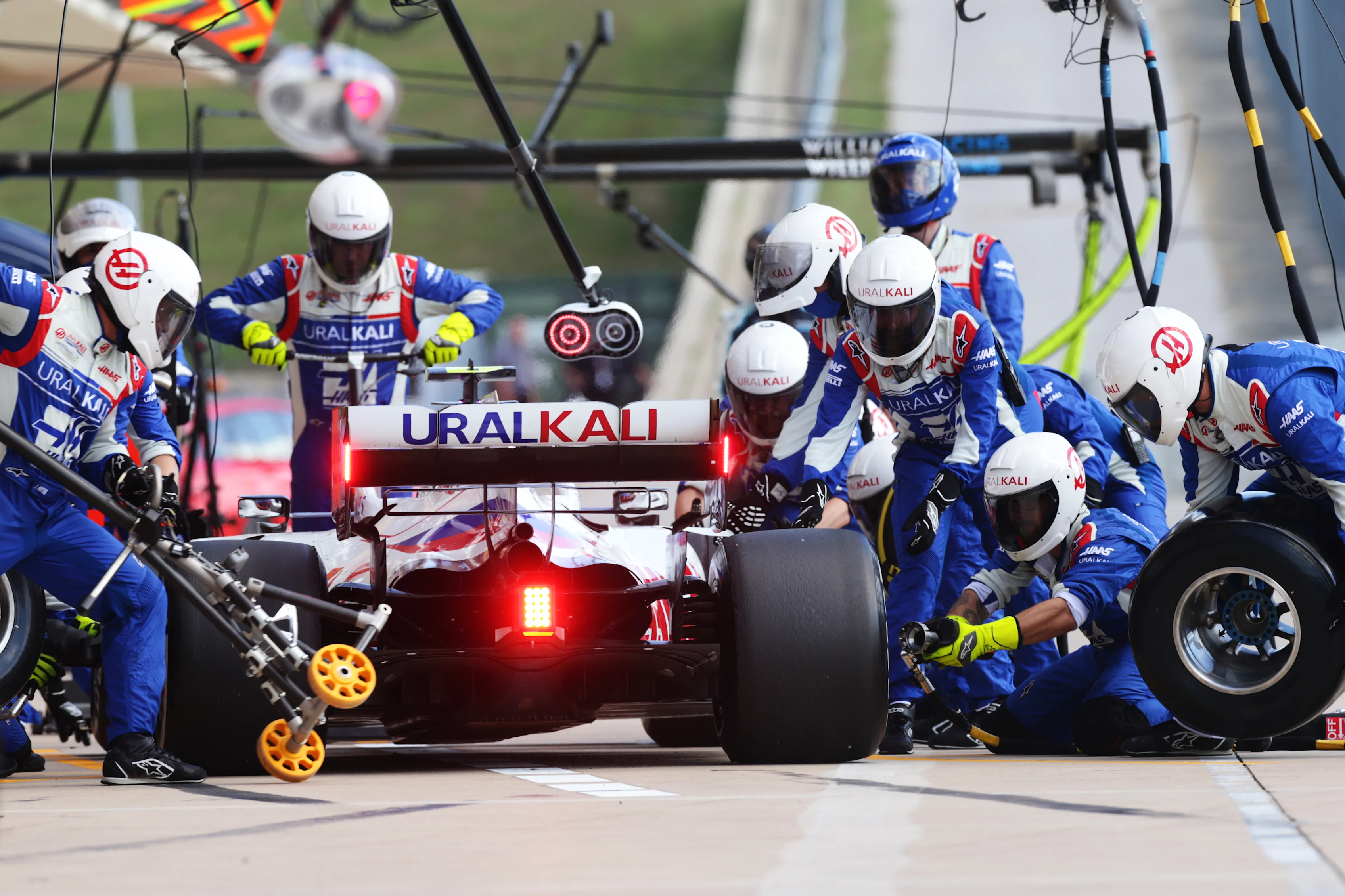 AUSTIN, TEXAS - OCTOBER 24: Mick Schumacher of Germany driving the (47) Haas F1 Team VF-21 Ferrari makes a pitstop during the F1 Grand Prix of USA at Circuit of The Americas on October 24, 2021 in Austin, Texas. (Photo by Peter Fox/Getty Images)