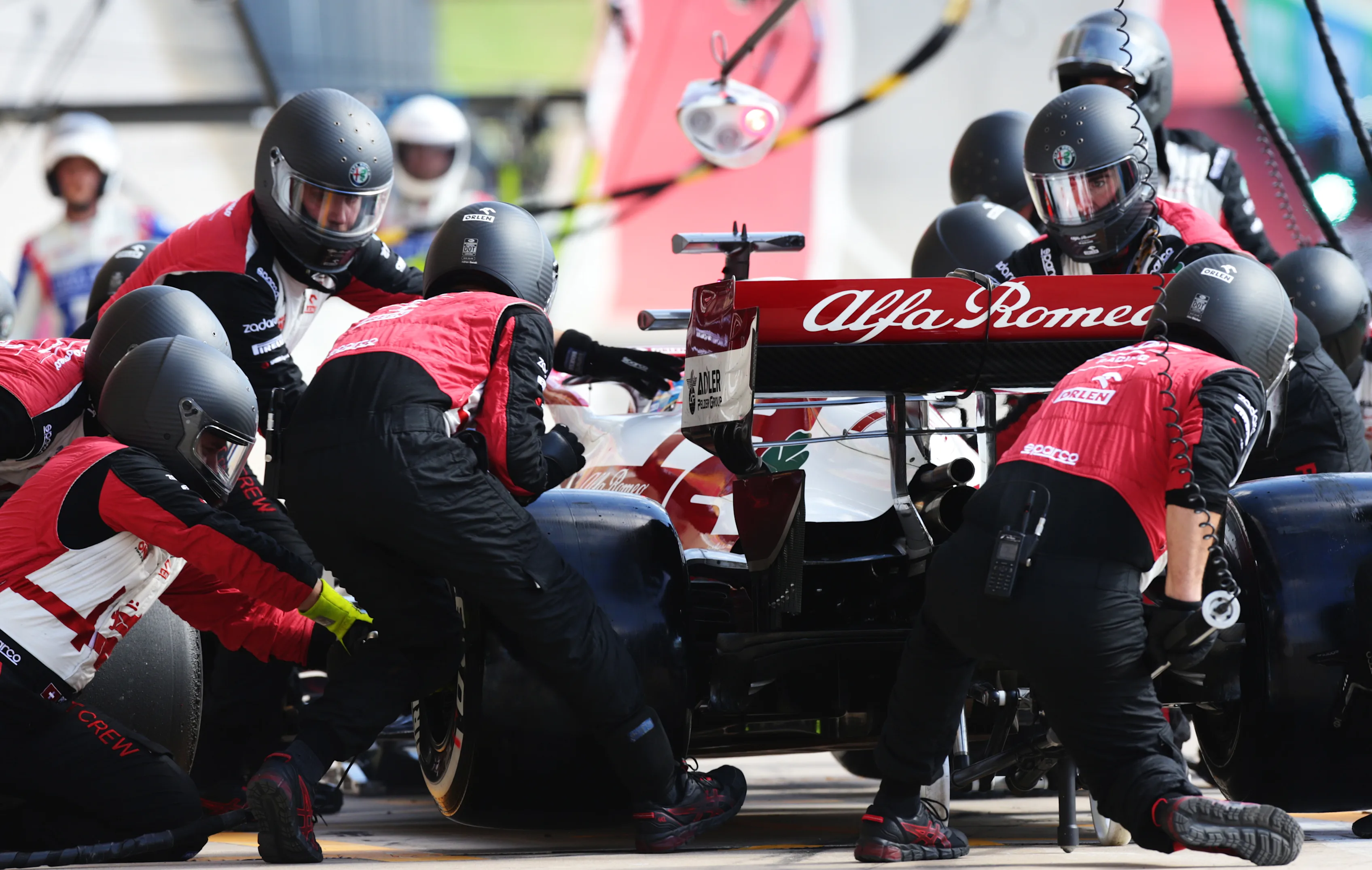AUSTIN, TEXAS - OCTOBER 24: Kimi Raikkonen of Finland driving the (7) Alfa Romeo Racing C41 Ferrari makes a pitstop during the F1 Grand Prix of USA at Circuit of The Americas on October 24, 2021 in Austin, Texas. (Photo by Peter Fox/Getty Images)
