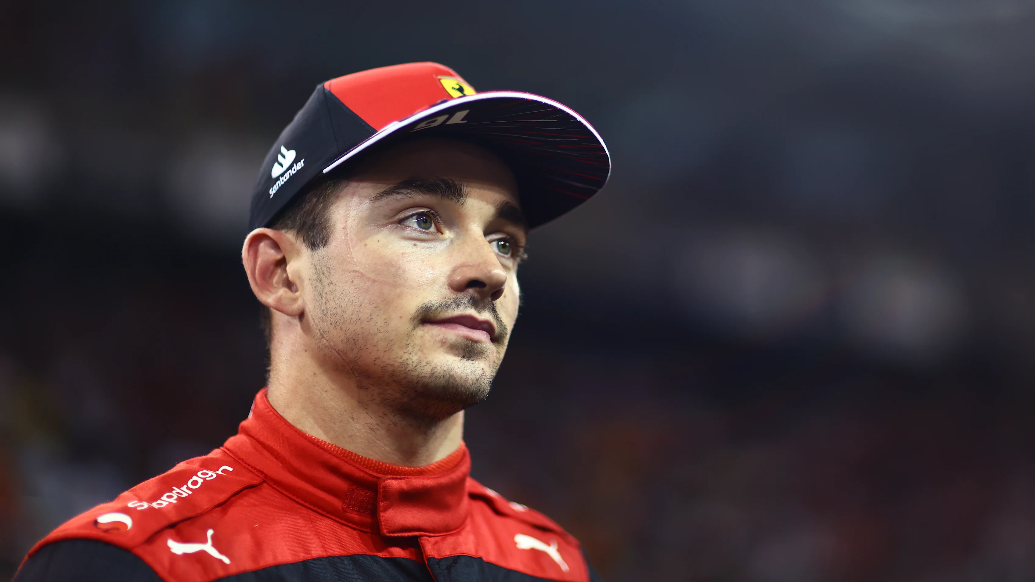 ABU DHABI, UNITED ARAB EMIRATES - NOVEMBER 19: Third placed qualifier Charles Leclerc of Monaco and Ferrari reacts in parc ferme during qualifying ahead of the F1 Grand Prix of Abu Dhabi at Yas Marina Circuit on November 19, 2022 in Abu Dhabi, United Arab Emirates. (Photo by Dan Istitene - Formula 1/Formula 1 via Getty Images)