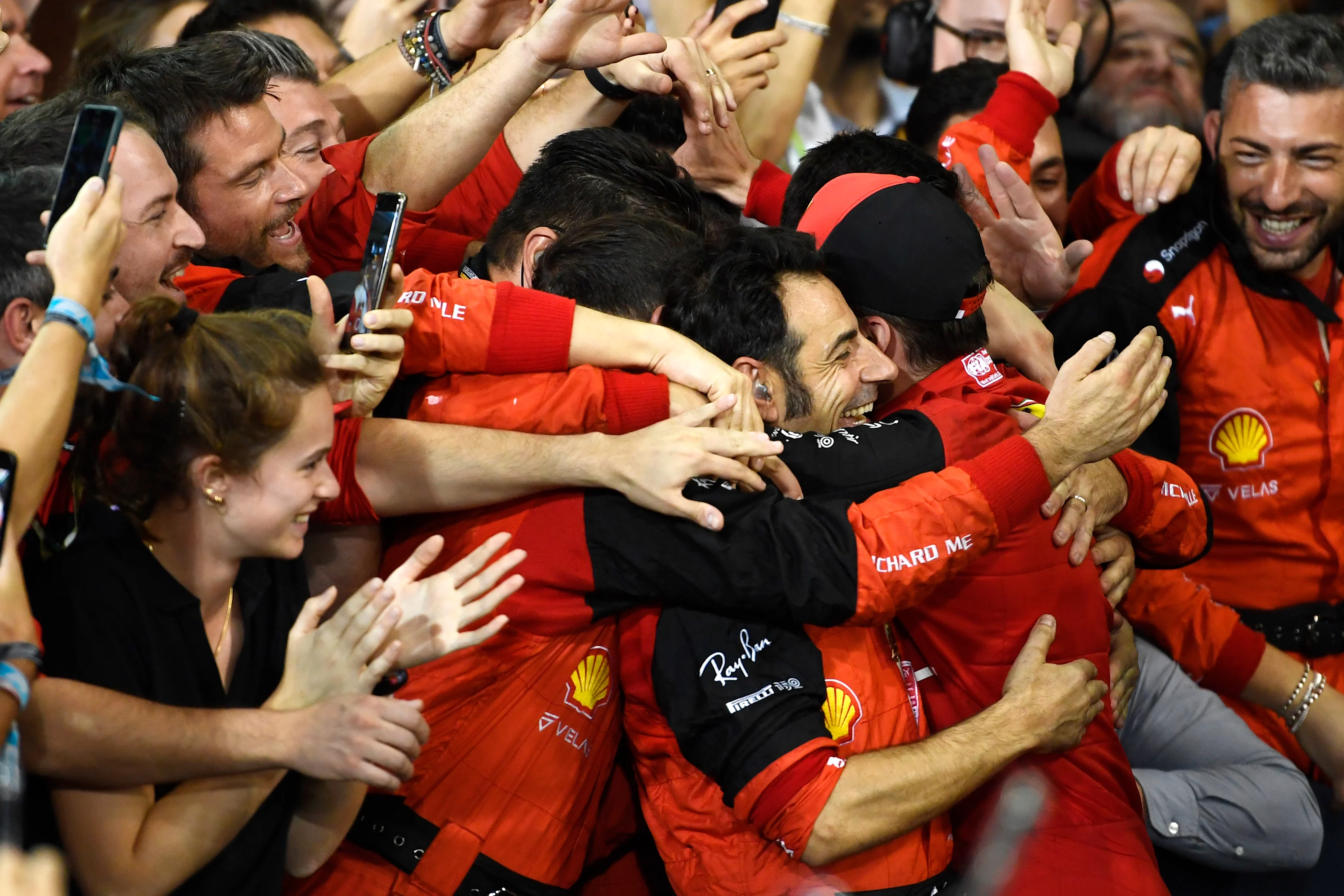 ABU DHABI, UNITED ARAB EMIRATES - NOVEMBER 20: Second placed Charles Leclerc of Monaco and Ferrari celebrates with teammates following the F1 Grand Prix of Abu Dhabi at Yas Marina Circuit on November 20, 2022 in Abu Dhabi, United Arab Emirates. (Photo by Rudy Carezzevoli/Getty Images)