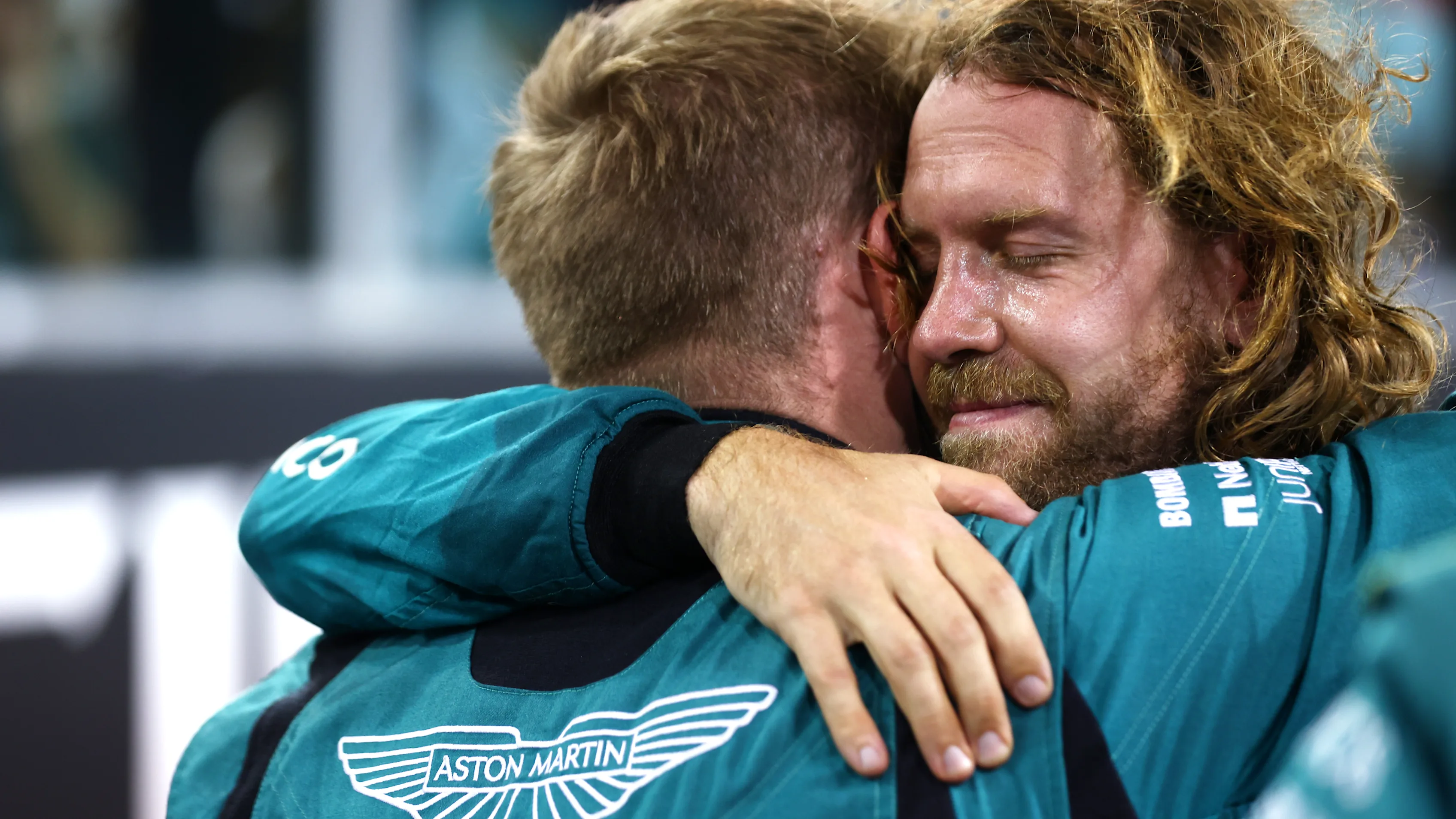 ABU DHABI, UNITED ARAB EMIRATES - NOVEMBER 20: Tenth placed Sebastian Vettel of Germany and Aston Martin F1 Team celebrates with team members following his final race in F1 during the F1 Grand Prix of Abu Dhabi at Yas Marina Circuit on November 20, 2022 in Abu Dhabi, United Arab Emirates. (Photo by Dan Istitene - Formula 1/Formula 1 via Getty Images)