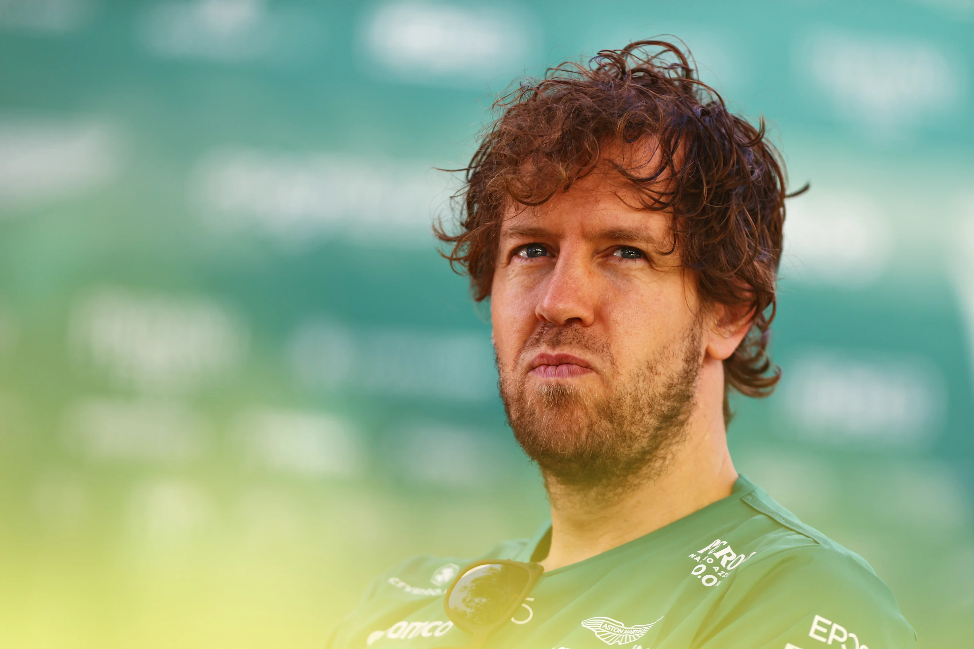 MELBOURNE, AUSTRALIA - APRIL 08: Sebastian Vettel of Germany and Aston Martin F1 Team looks on in the Paddock prior to practice ahead of the F1 Grand Prix of Australia at Melbourne Grand Prix Circuit on April 08, 2022 in Melbourne, Australia. (Photo by Dan Istitene - Formula 1/Formula 1 via Getty Images)