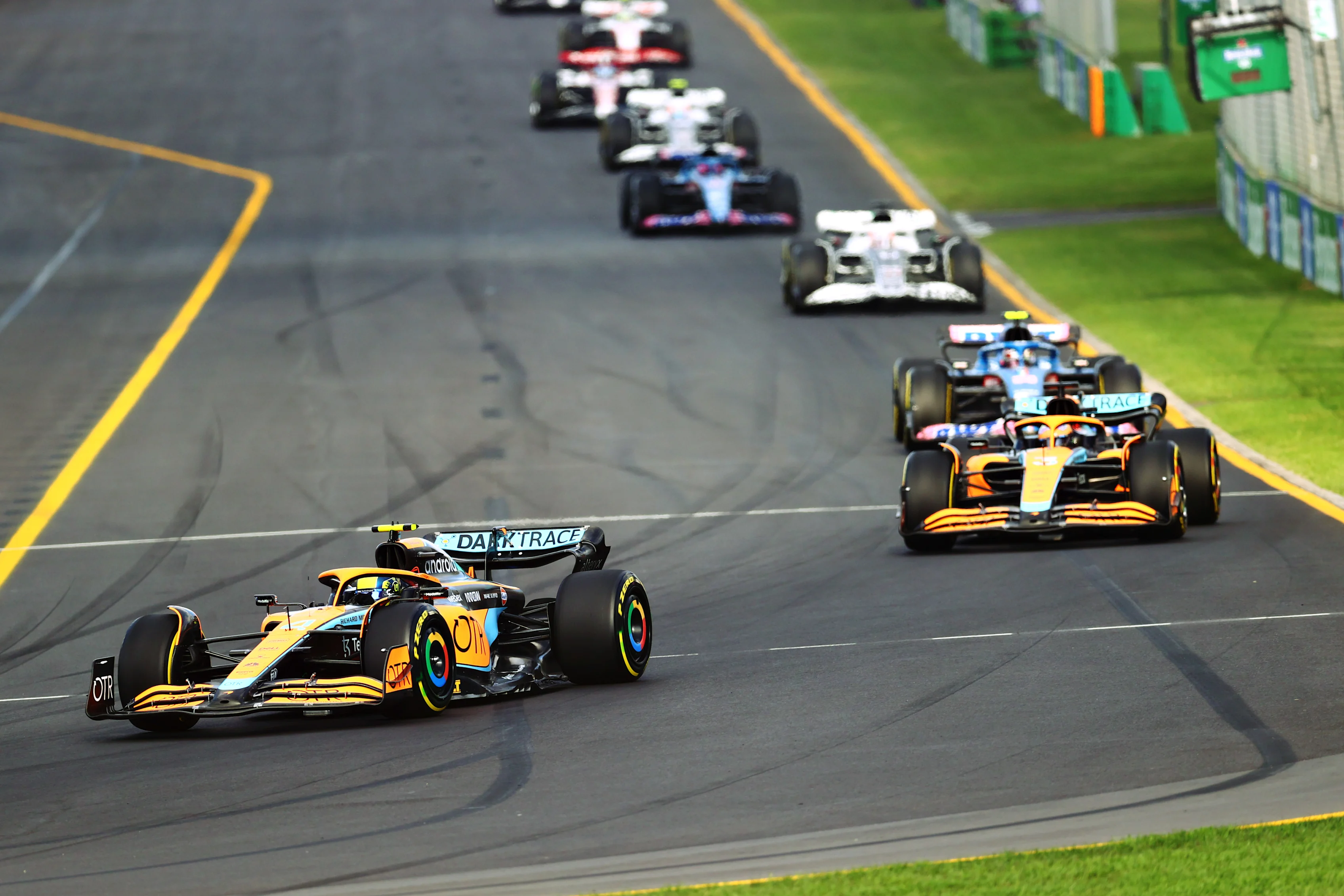 MELBOURNE, AUSTRALIA - APRIL 10: Lando Norris of Great Britain driving the (4) McLaren MCL36 Mercedes leads Daniel Ricciardo of Australia driving the (3) McLaren MCL36 Mercedes during the F1 Grand Prix of Australia at Melbourne Grand Prix Circuit on April 10, 2022 in Melbourne, Australia. (Photo by Dan Istitene - Formula 1/Formula 1 via Getty Images)