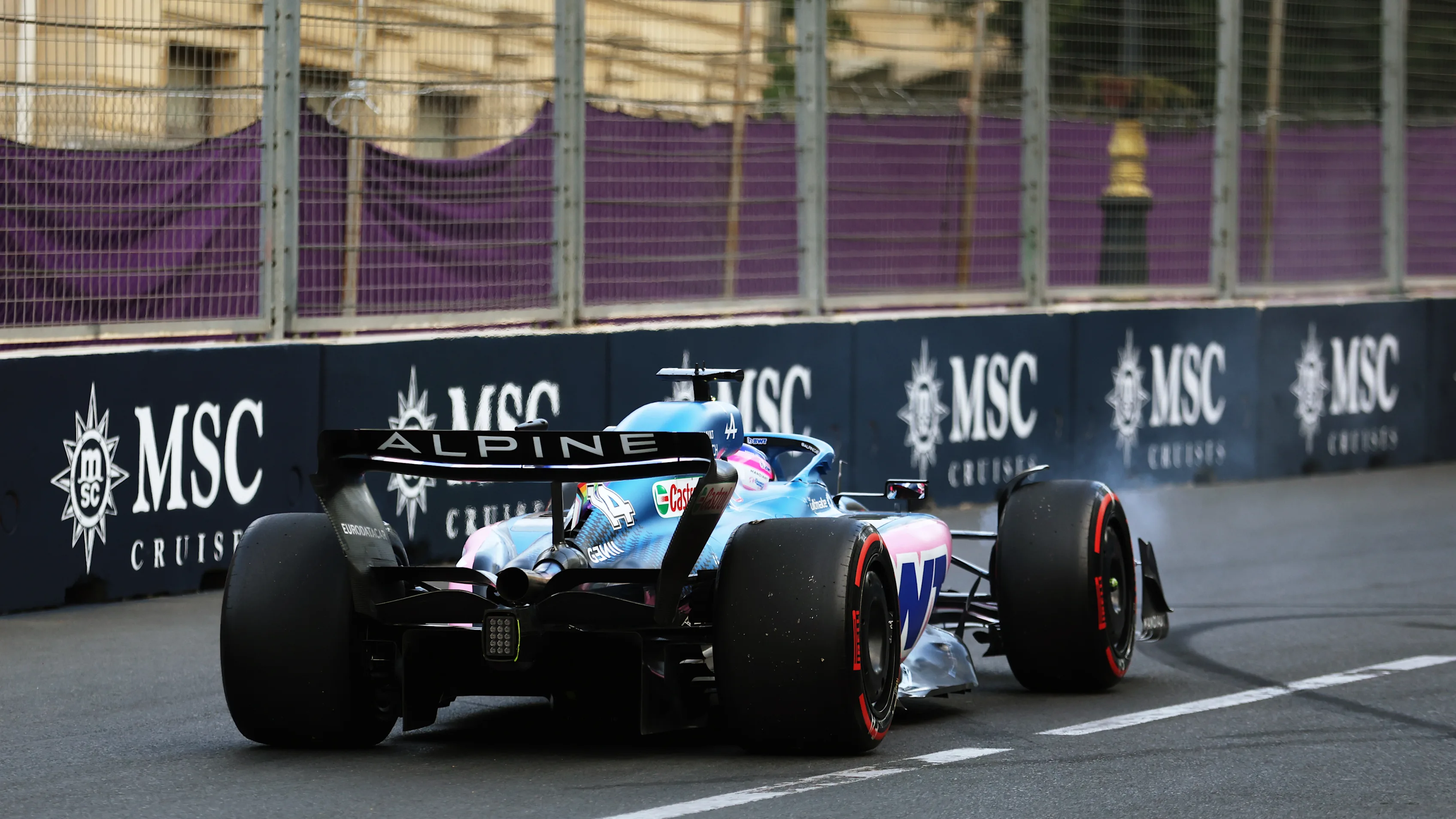 BAKU, AZERBAIJAN - JUNE 11: Fernando Alonso of Spain driving the (14) Alpine F1 A522 Renault into the runoff area at turn fifteen during qualifying ahead of the F1 Grand Prix of Azerbaijan at Baku City Circuit on June 11, 2022 in Baku, Azerbaijan. (Photo by Bryn Lennon - Formula 1/Formula 1 via Getty Images)