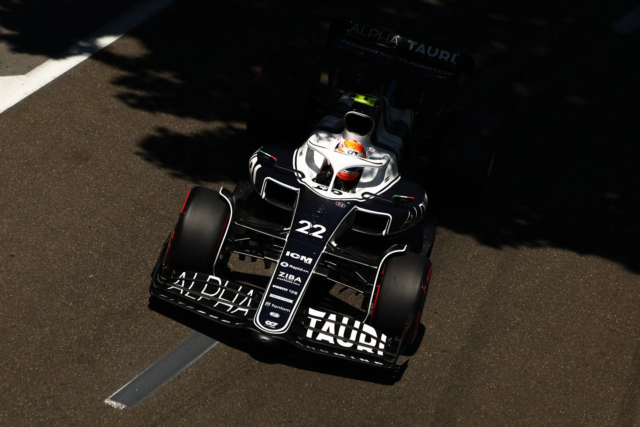 BAKU, AZERBAIJAN - JUNE 12: Yuki Tsunoda of Japan driving the (22) Scuderia AlphaTauri AT03 on his way to the grid ahead of the F1 Grand Prix of Azerbaijan at Baku City Circuit on June 12, 2022 in Baku, Azerbaijan. (Photo by Clive Rose/Getty Images)
