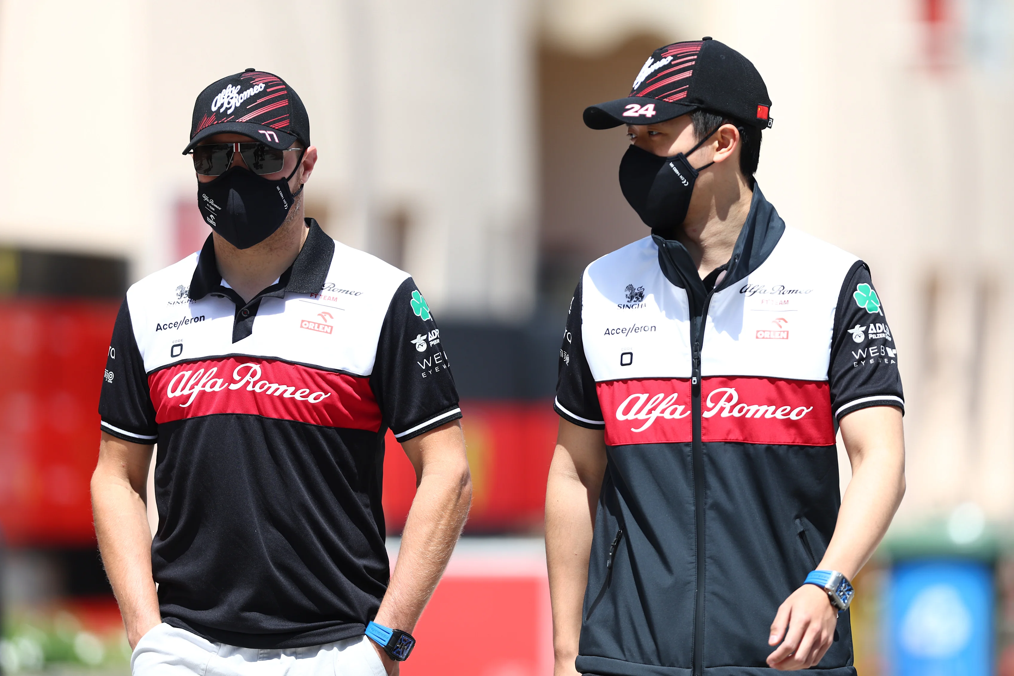 BAHRAIN, BAHRAIN - MARCH 18: Zhou Guanyu of China and Alfa Romeo F1 and Valtteri Bottas of Finland