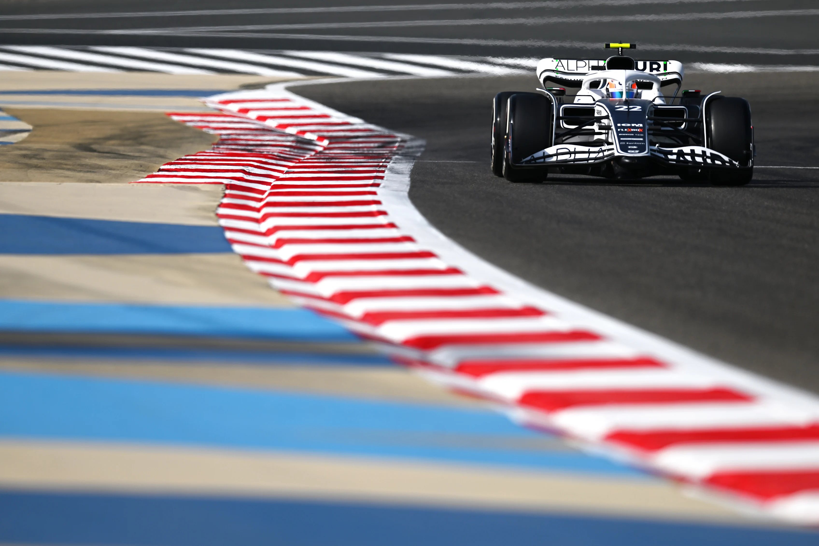 BAHRAIN, BAHRAIN - MARCH 18: Yuki Tsunoda of Japan driving the (22) Scuderia AlphaTauri AT03 on track during practice ahead of the F1 Grand Prix of Bahrain at Bahrain International Circuit on March 18, 2022 in Bahrain, Bahrain. (Photo by Clive Mason/Getty Images)