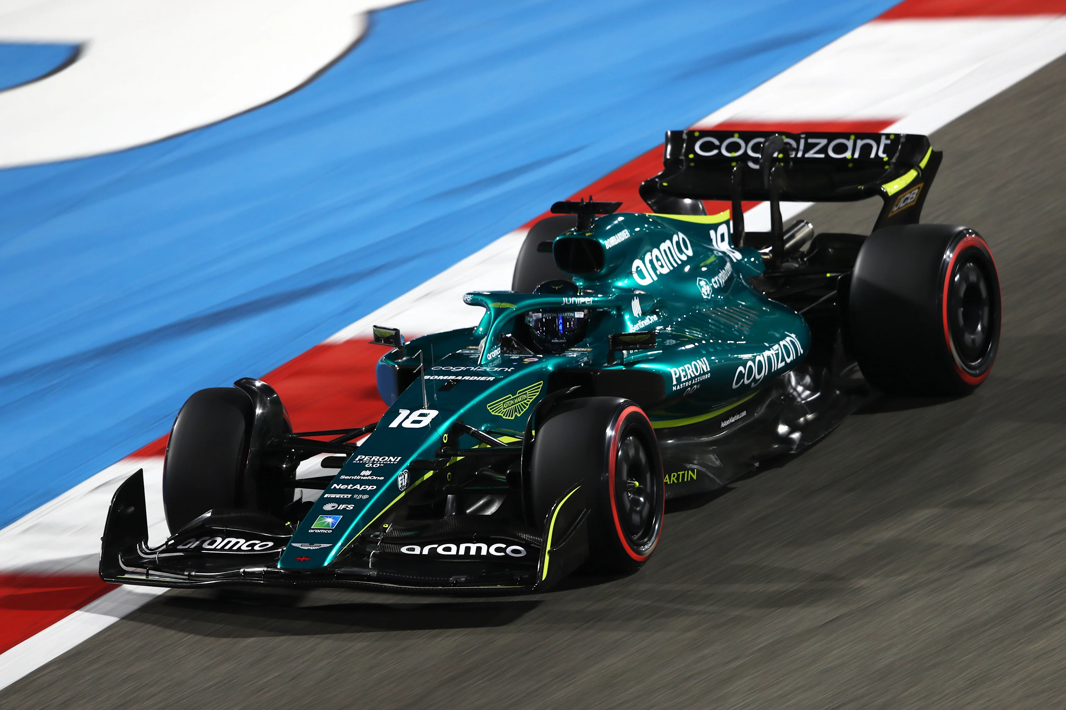 BAHRAIN, BAHRAIN - MARCH 18: Lance Stroll of Canada driving the (18) Aston Martin AMR22 Mercedes on track during practice ahead of the F1 Grand Prix of Bahrain at Bahrain International Circuit on March 18, 2022 in Bahrain, Bahrain. (Photo by Joe Portlock - Formula 1/Formula 1 via Getty Images)