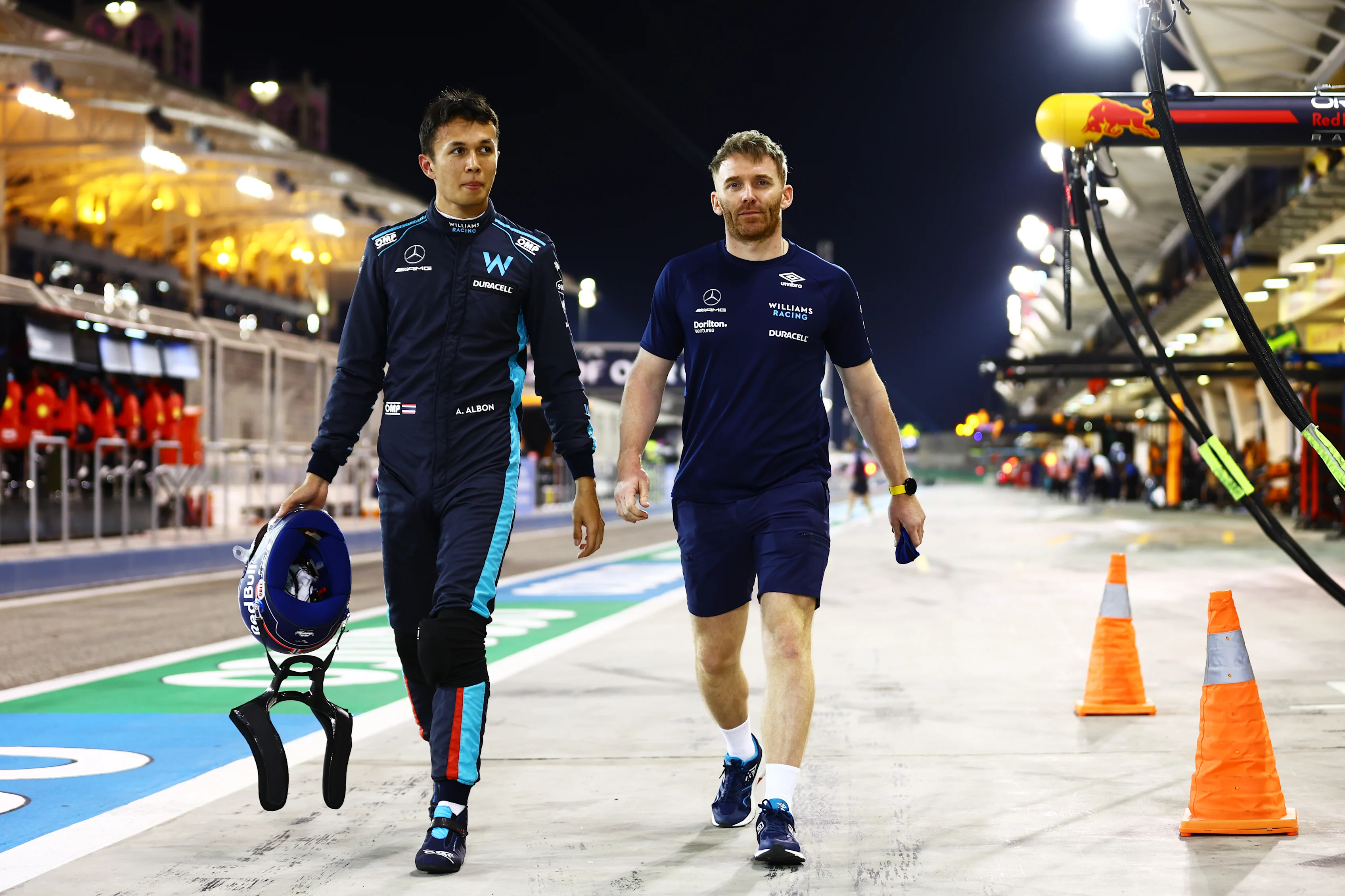 BAHRAIN, BAHRAIN - MARCH 19: Alexander Albon of Thailand and Williams walks in the Pitlane after qualifying in 14th position during qualifying ahead of the F1 Grand Prix of Bahrain at Bahrain International Circuit on March 19, 2022 in Bahrain, Bahrain. (Photo by Mark Thompson/Getty Images)