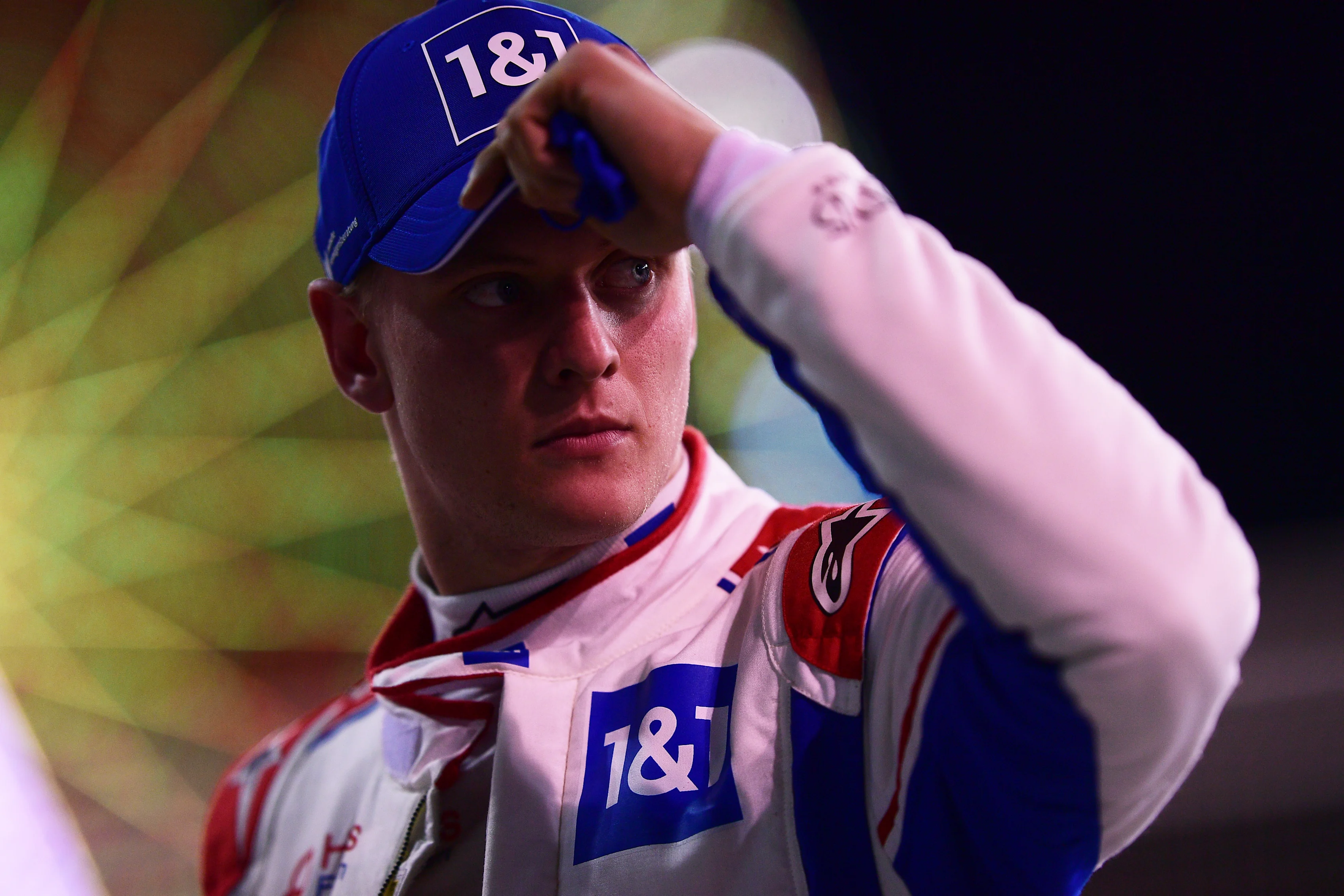BAHRAIN, BAHRAIN - MARCH 19: Mick Schumacher of Germany and Haas F1 looks on from parc ferme after qualifying in 12th position during qualifying ahead of the F1 Grand Prix of Bahrain at Bahrain International Circuit on March 19, 2022 in Bahrain, Bahrain. (Photo by Mario Renzi - Formula 1/Formula 1 via Getty Images)