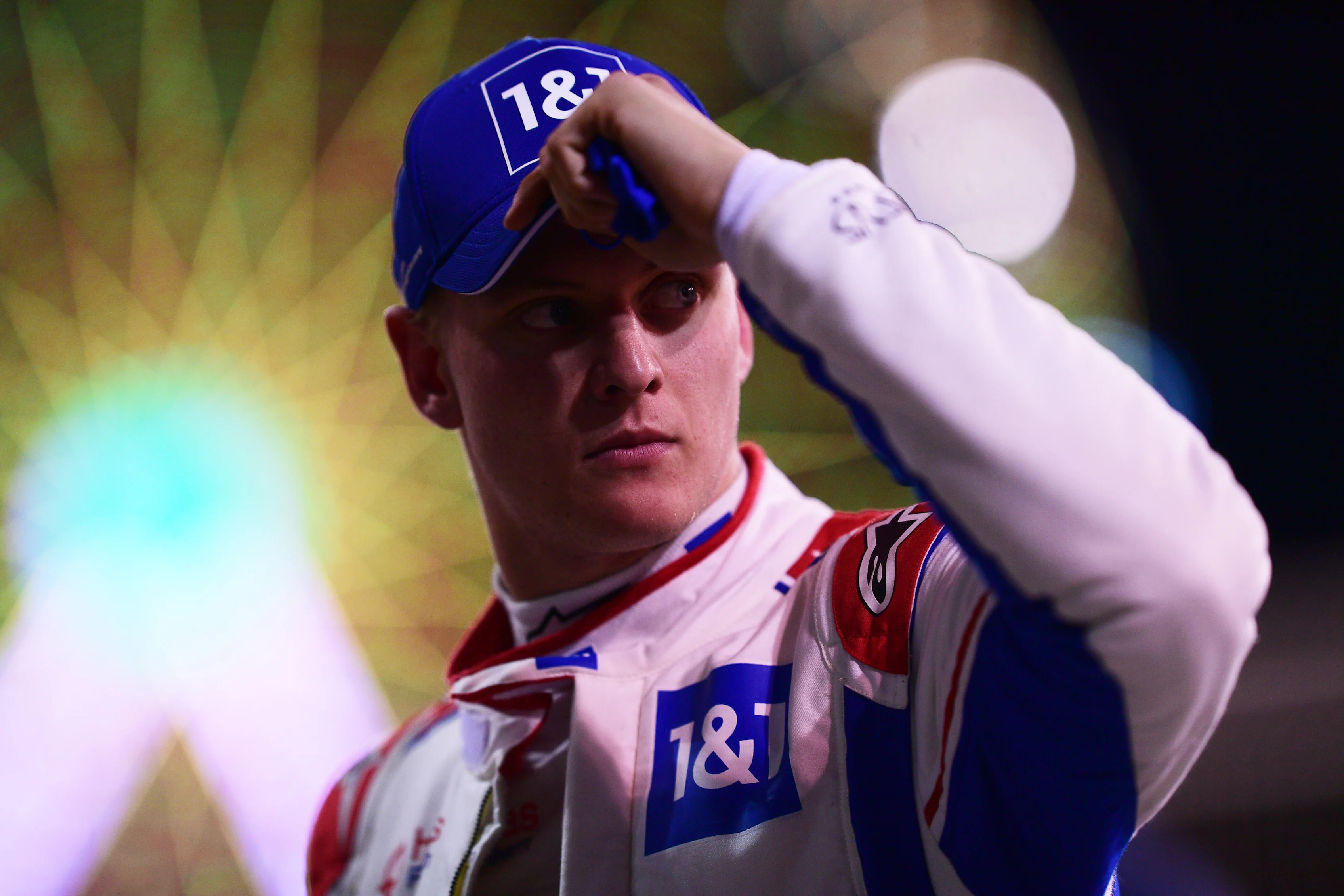 BAHRAIN, BAHRAIN - MARCH 19: Mick Schumacher of Germany and Haas F1 looks on from parc ferme after