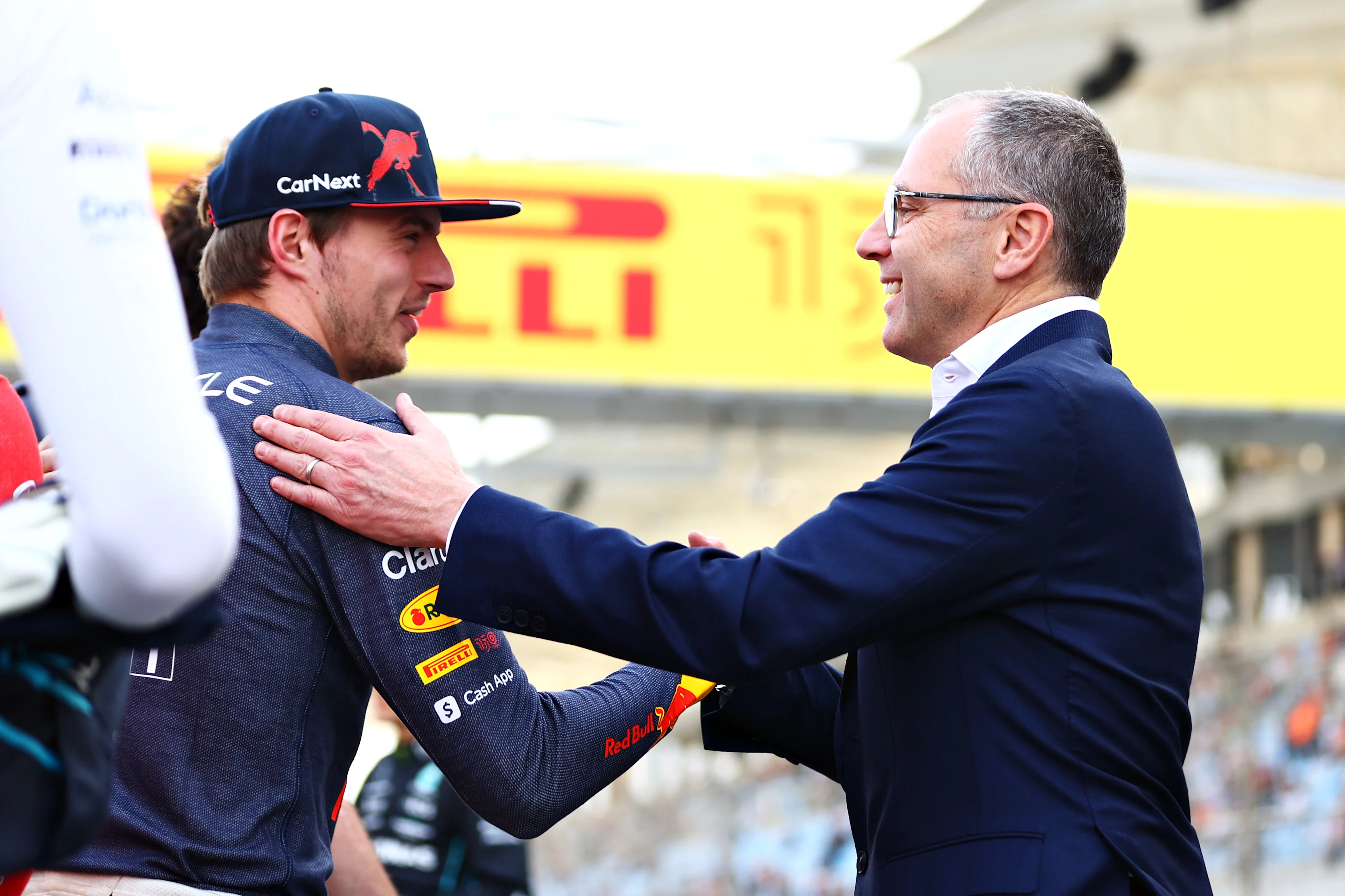 BAHRAIN, BAHRAIN - MARCH 20: Stefano Domenicali, CEO of the Formula One Group, greets Max