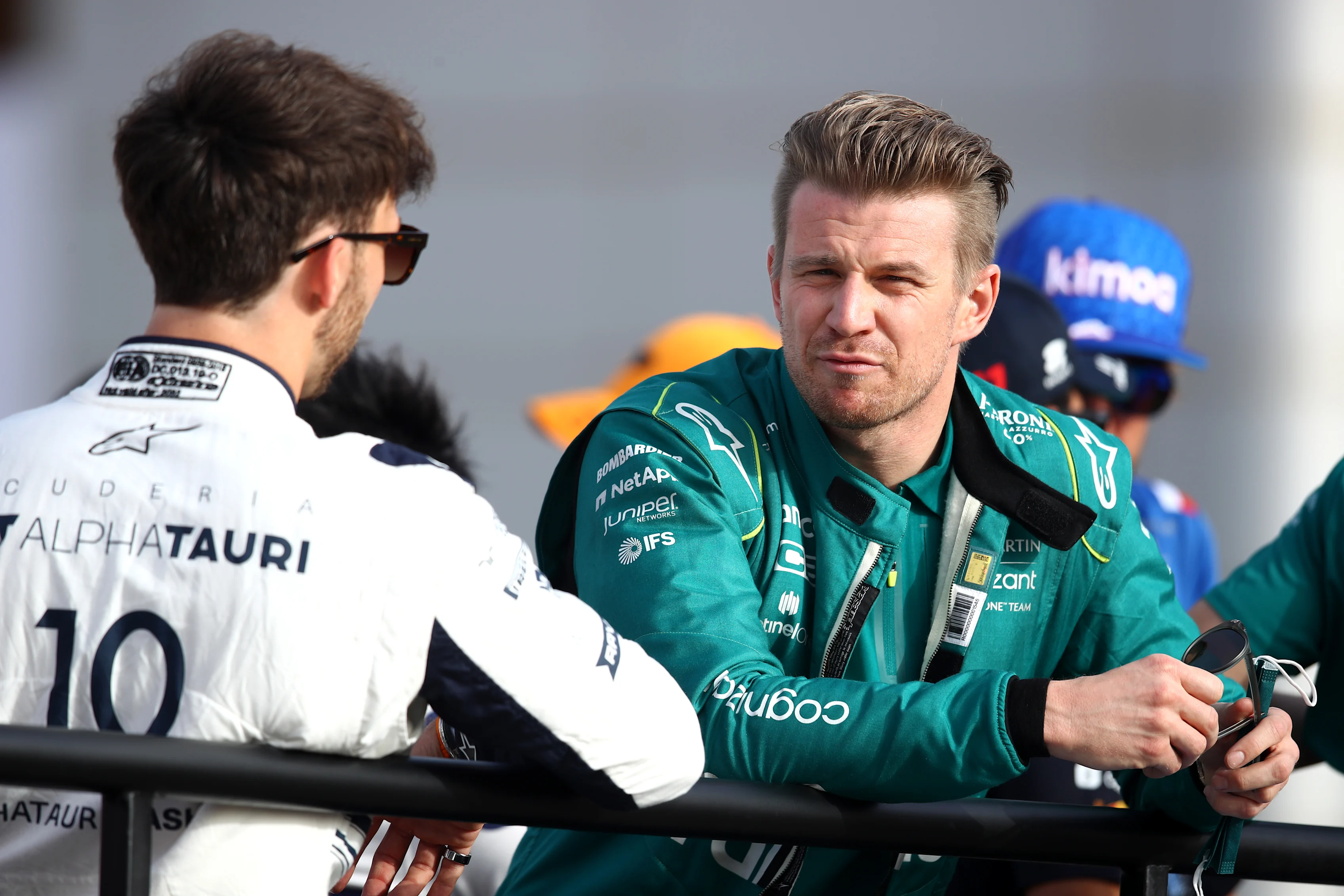 BAHRAIN, BAHRAIN - MARCH 20: Nico Hulkenberg of Germany and Aston Martin F1 Team talks with Pierre Gasly of France and Scuderia AlphaTauri during the drivers parade prior to the F1 Grand Prix of Bahrain at Bahrain International Circuit on March 20, 2022 in Bahrain, Bahrain. (Photo by Joe Portlock - Formula 1/Formula 1 via Getty Images)