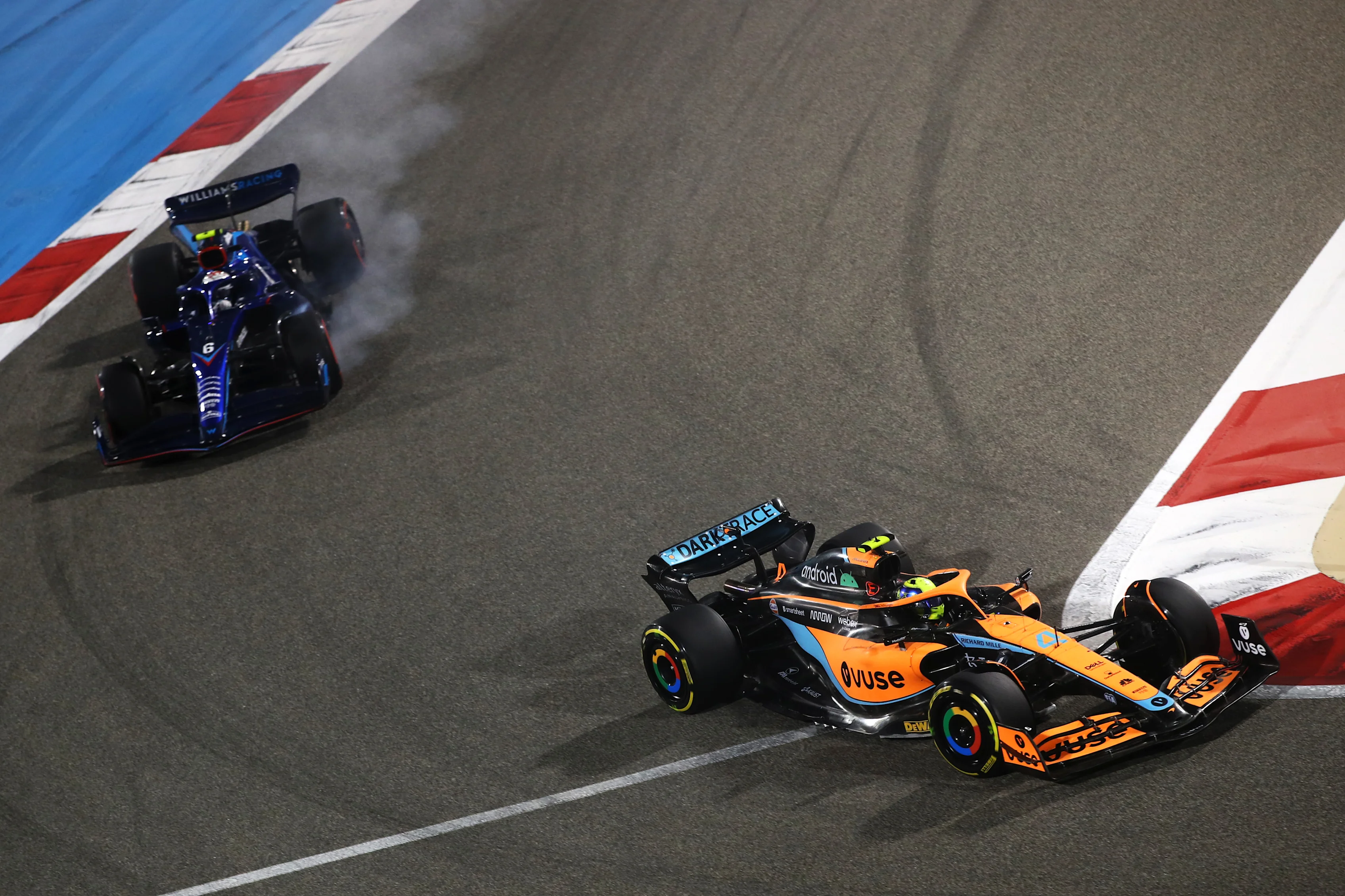 BAHRAIN, BAHRAIN - MARCH 20: Lando Norris of Great Britain driving the (4) McLaren MCL36 Mercedes leads Nicholas Latifi driving the (6) Williams FW44 Mercedes during the F1 Grand Prix of Bahrain at Bahrain International Circuit on March 20, 2022 in Bahrain, Bahrain. (Photo by Joe Portlock - Formula 1/Formula 1 via Getty Images)