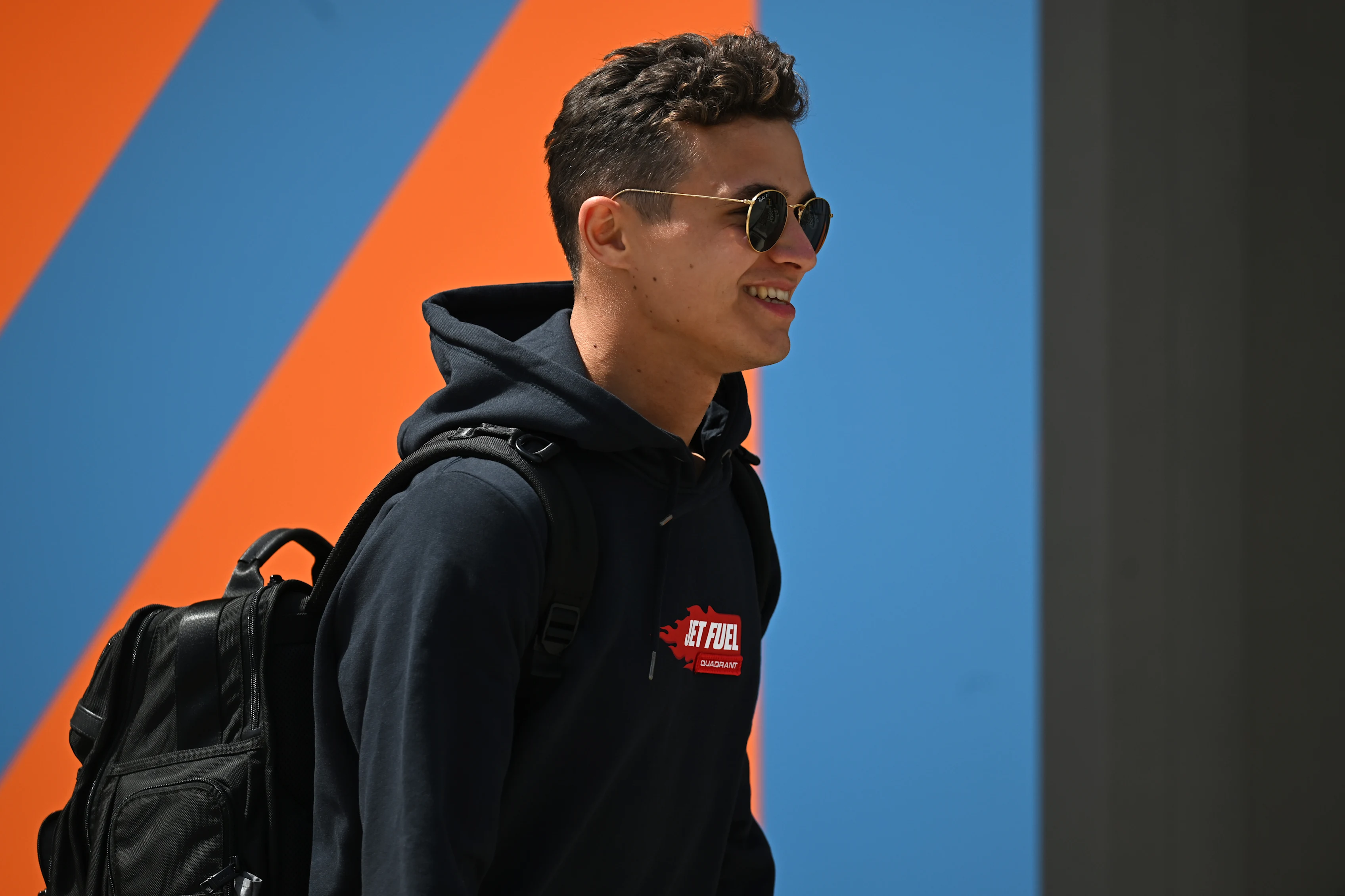 BAHRAIN, BAHRAIN - MARCH 17: Lando Norris of Great Britain and McLaren walks in the Paddock during