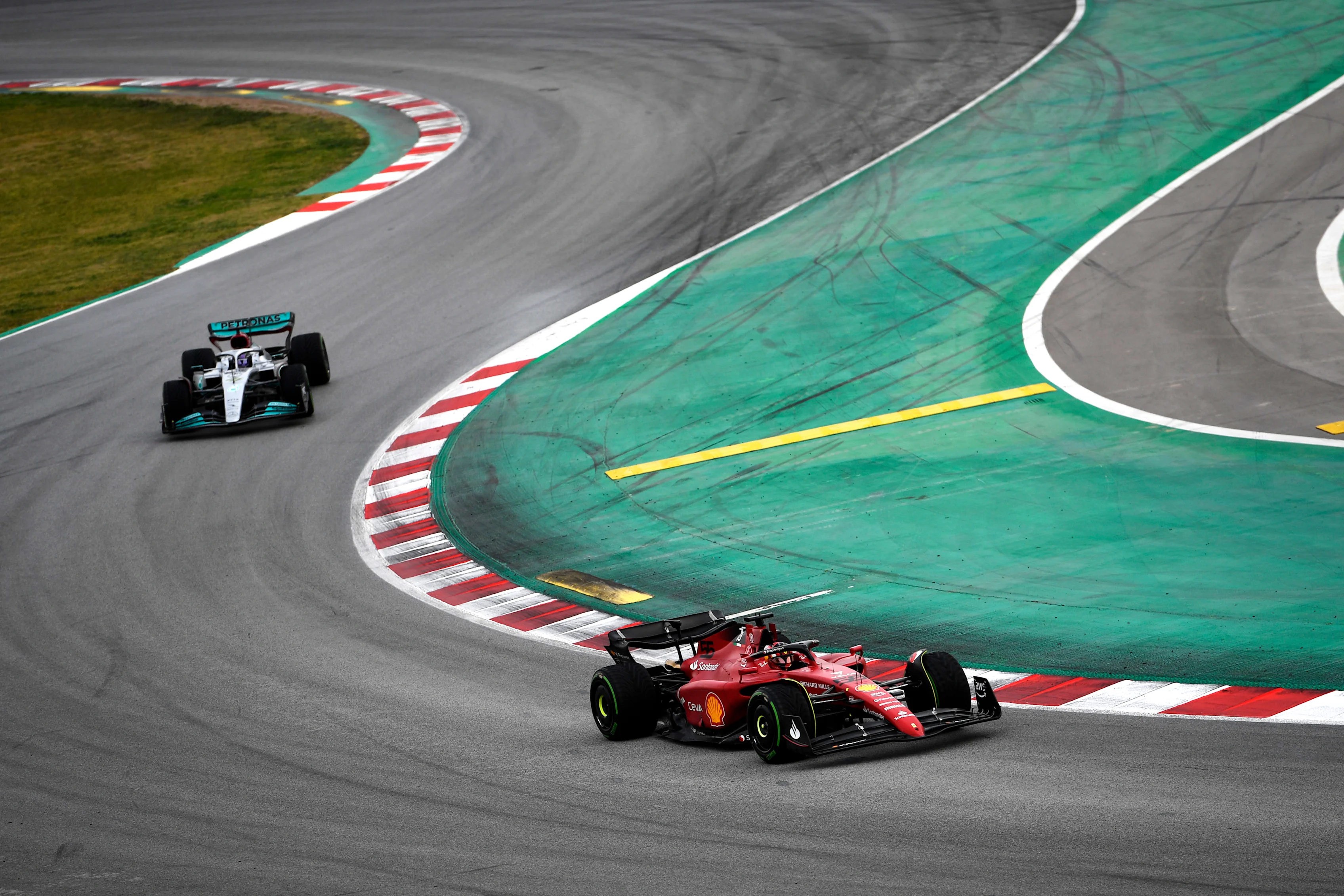 BARCELONA, SPAIN - FEBRUARY 25: Carlos Sainz of Spain driving (55) the Ferrari F1-75 leads Lewis