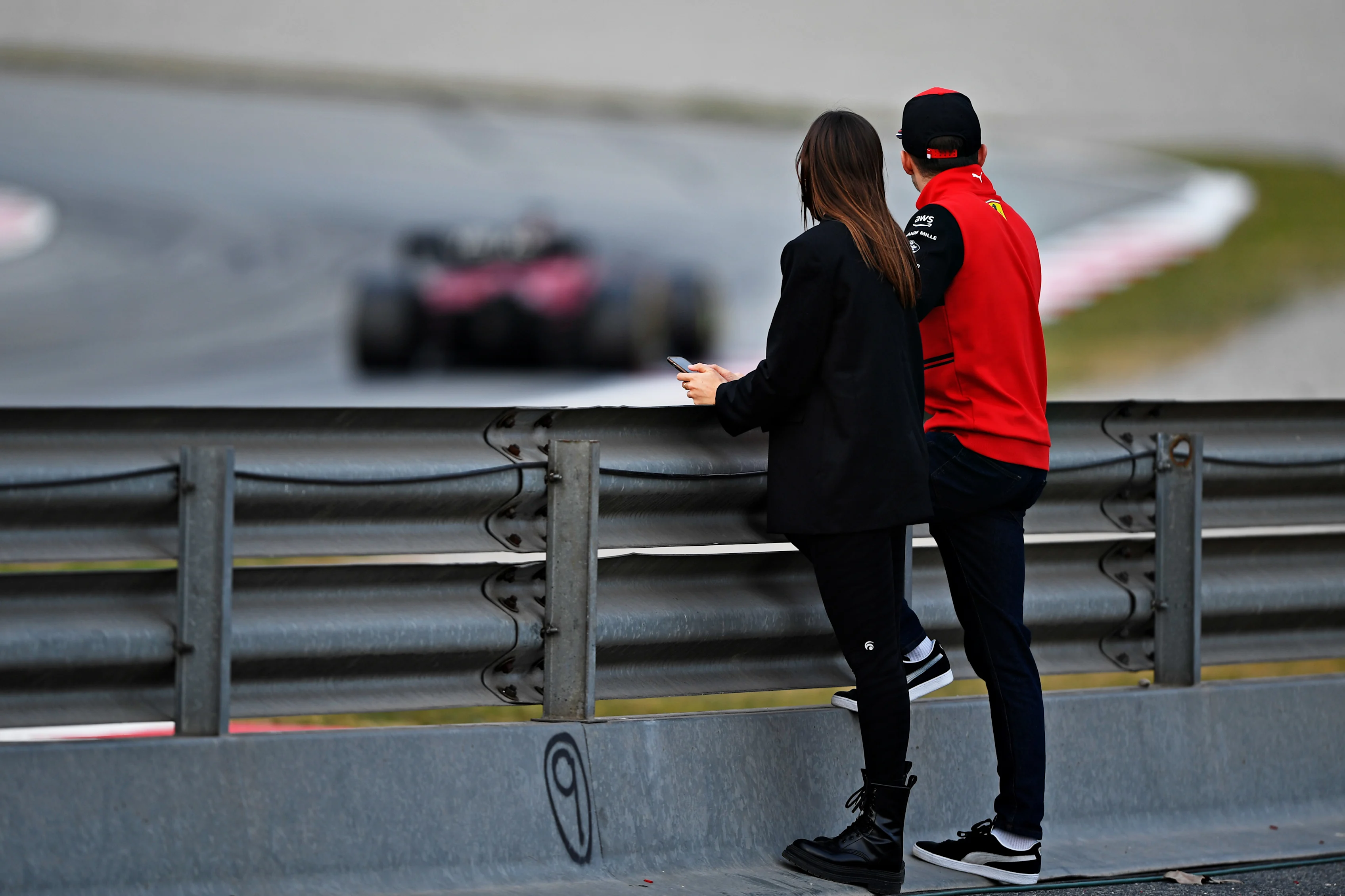 BARCELONA, SPAIN - FEBRUARY 25: Charles Leclerc of Monaco and Ferrari and his girlfriend Charlotte