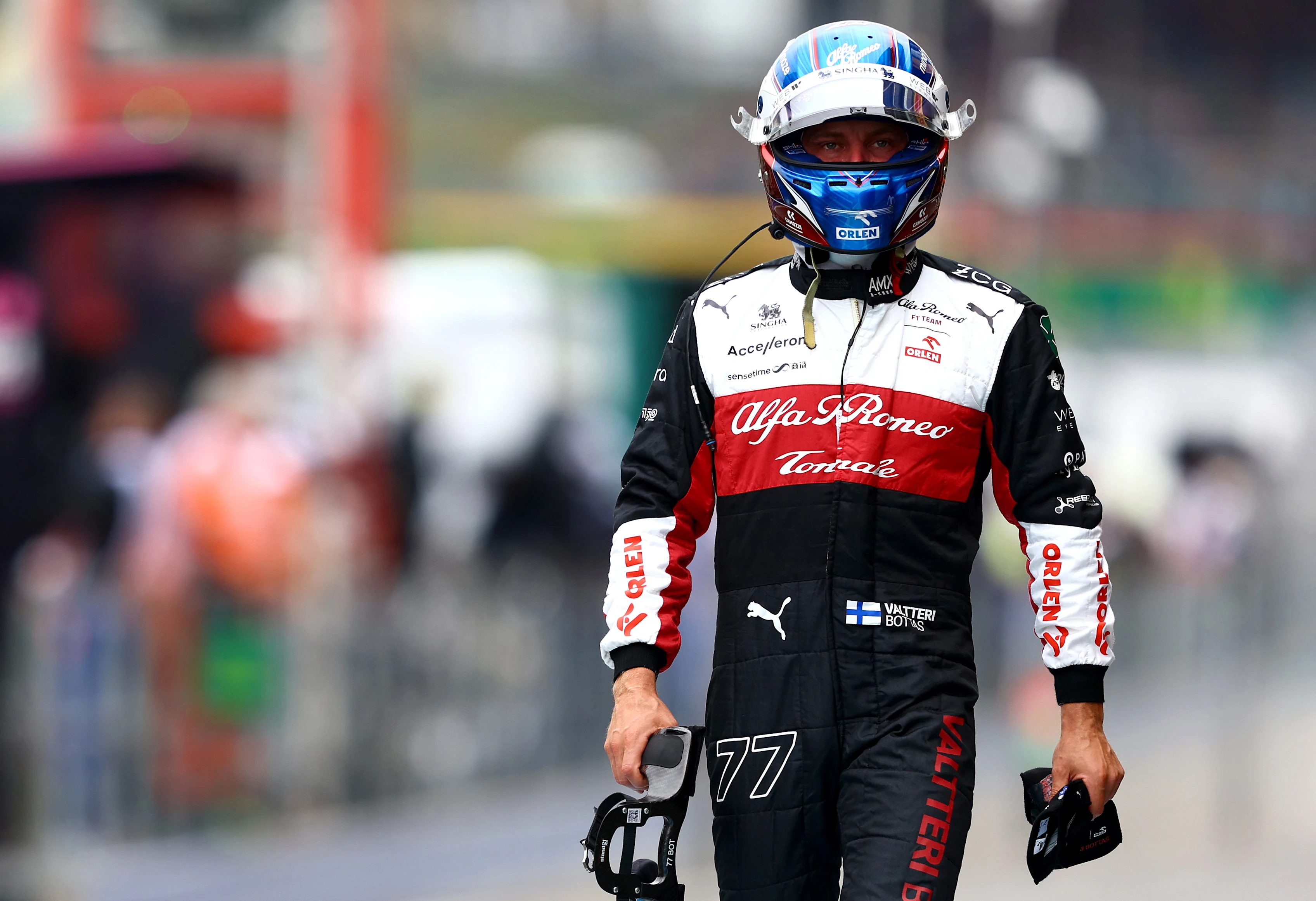SPA, BELGIUM - AUGUST 27: 20th place qualifier Valtteri Bottas of Finland and Alfa Romeo F1 walks in the Pitlane during qualifying ahead of the F1 Grand Prix of Belgium at Circuit de Spa-Francorchamps on August 27, 2022 in Spa, Belgium. (Photo by Mark Thompson/Getty Images)