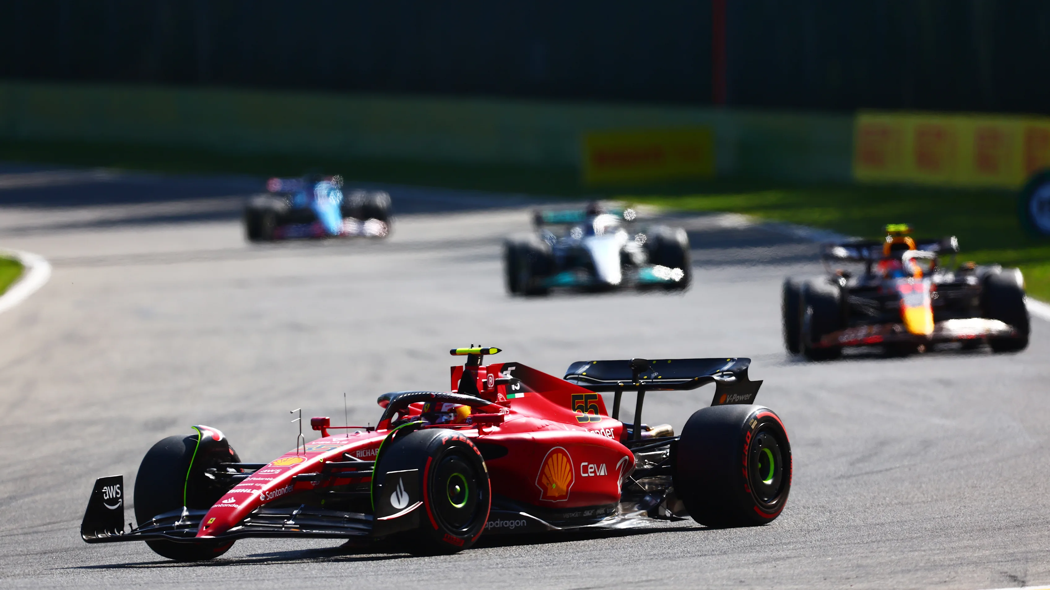 SPA, BELGIUM - AUGUST 28: Carlos Sainz of Spain driving (55) the Ferrari F1-75 leads Sergio Perez
