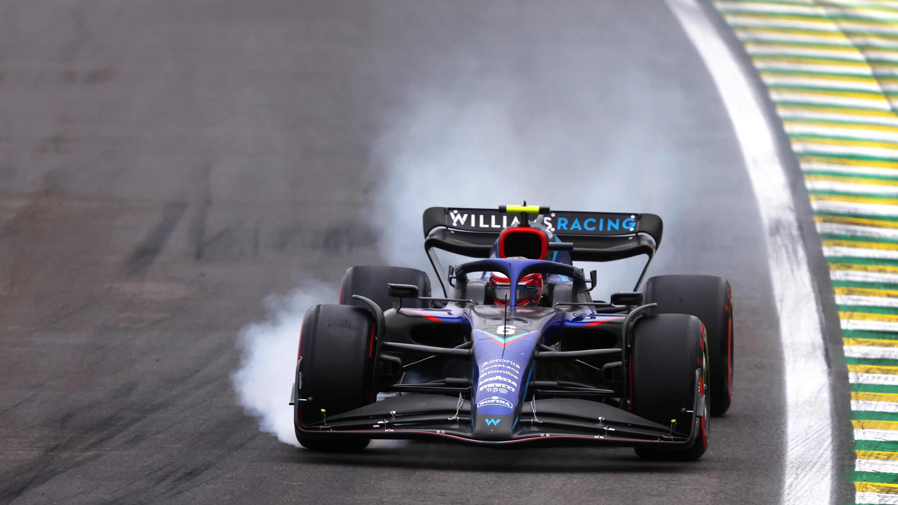 SAO PAULO, BRAZIL - NOVEMBER 11: Nicholas Latifi of Canada driving the (6) Williams FW44 Mercedes locks a wheel under braking during qualifying ahead of the F1 Grand Prix of Brazil at Autodromo Jose Carlos Pace on November 11, 2022 in Sao Paulo, Brazil. (Photo by Bryn Lennon - Formula 1/Formula 1 via Getty Images)